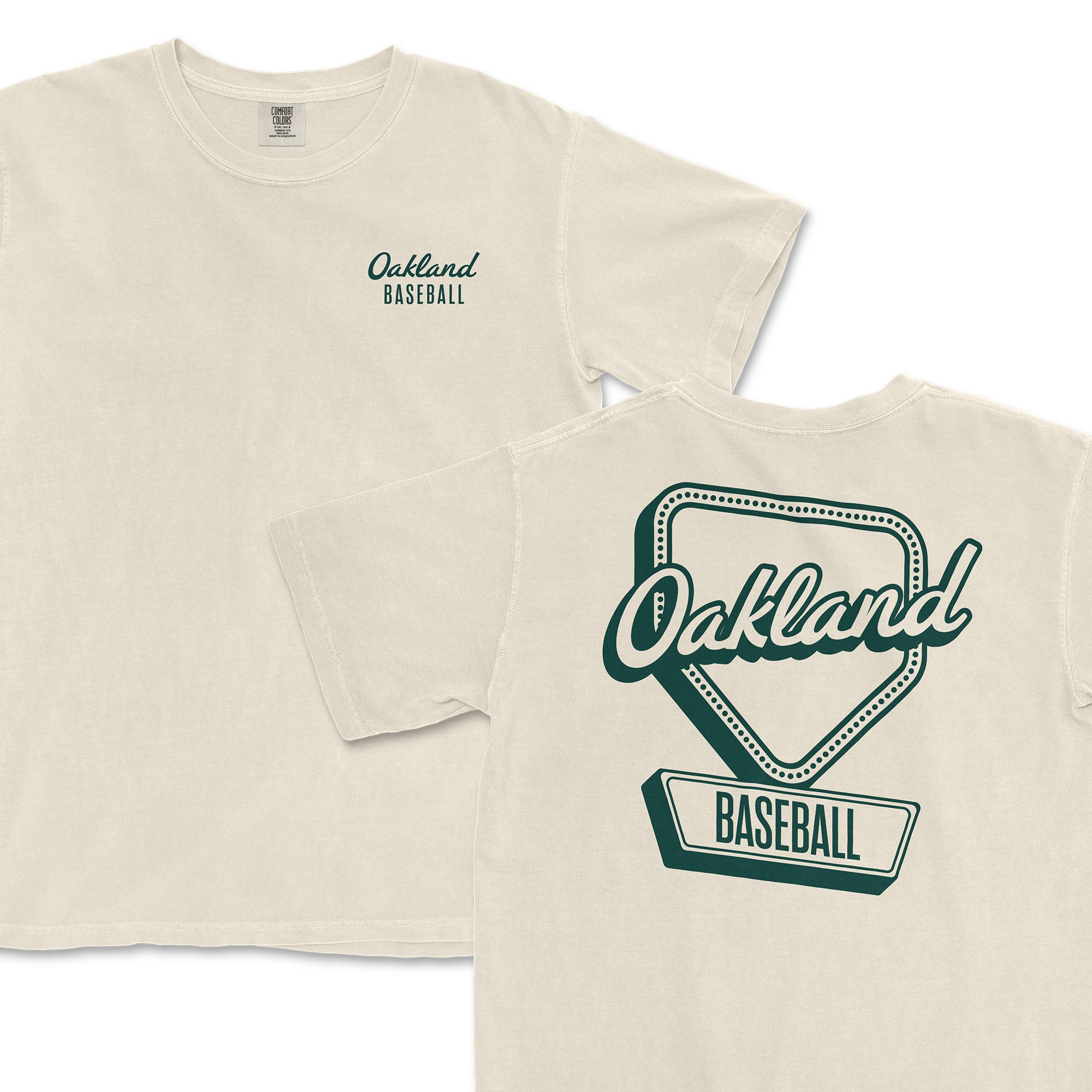Cream-colored t-shirt featuring "Oakland Baseball" text and a home plate graphic on the back. Perfect for fans.