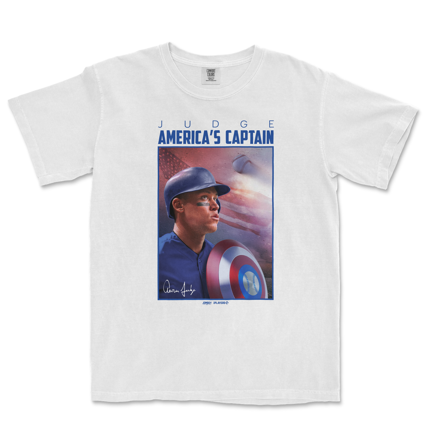 White Comfort Colors T-shirt featuring a graphic of Aaron Judge as America's Captain, with a baseball, shield, and patriotic background.