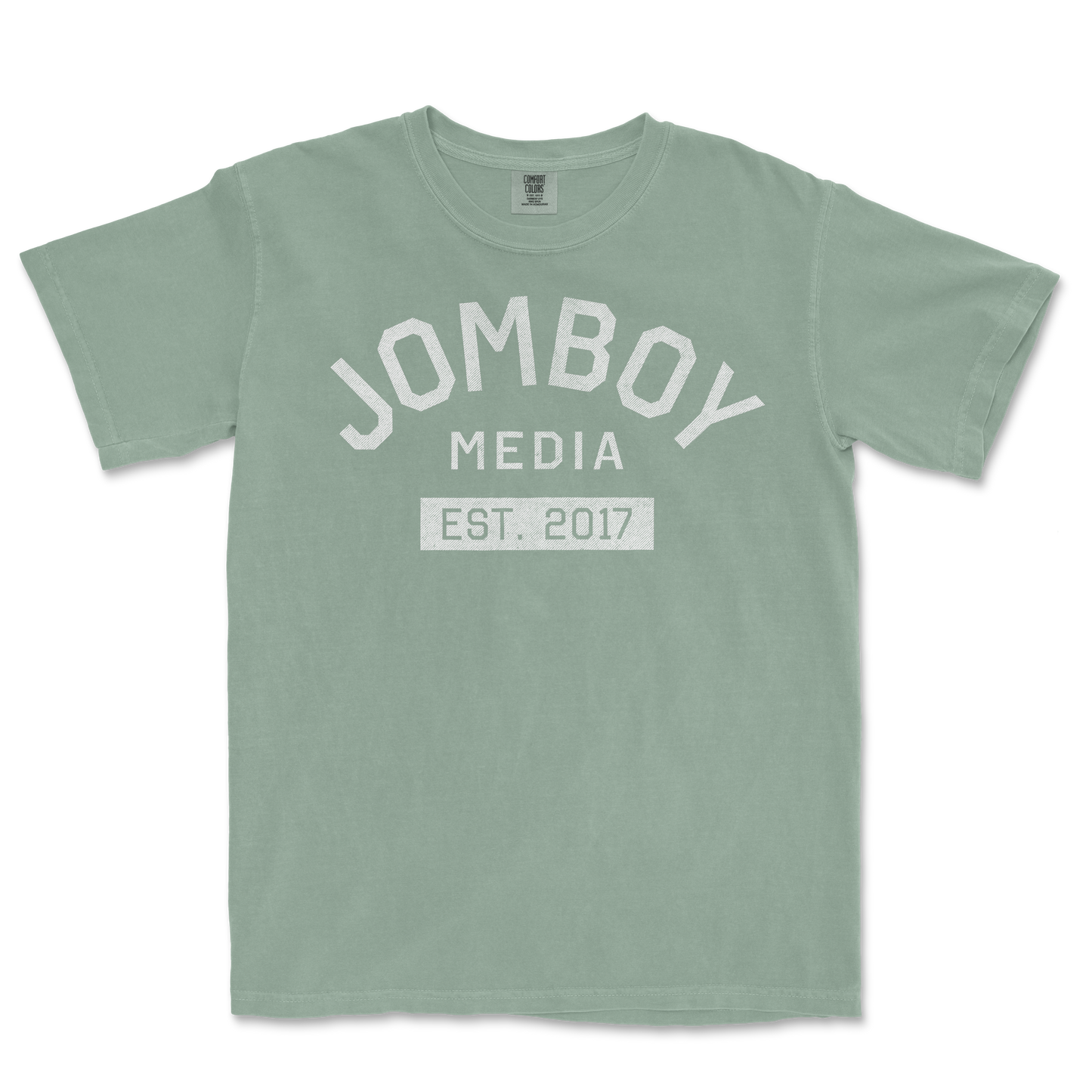 Light green Comfort Colors T-shirt with "Jomboy Media Est. 2017" printed in white on the front.