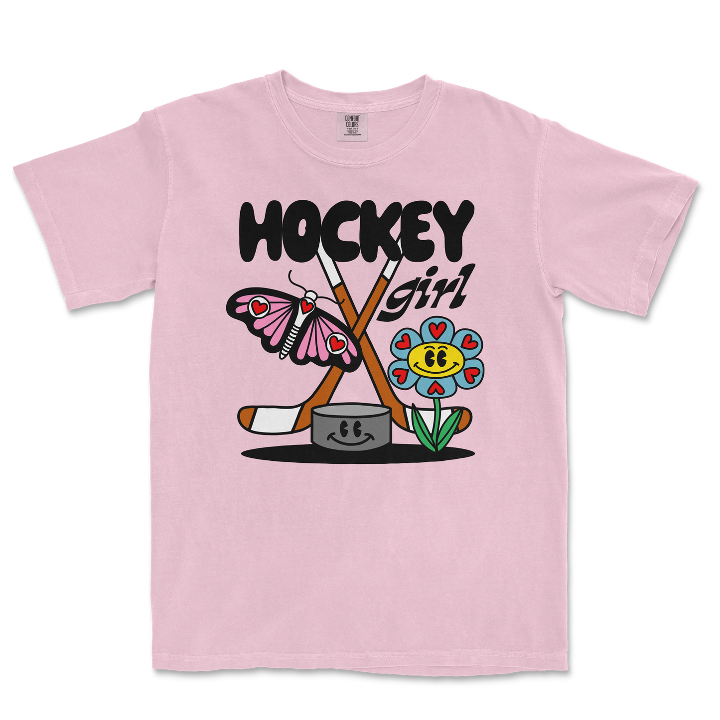Pink Comfort Colors tee featuring a colorful cartoon design of a butterfly, flower, hockey sticks, and the text "Hockey Girl.