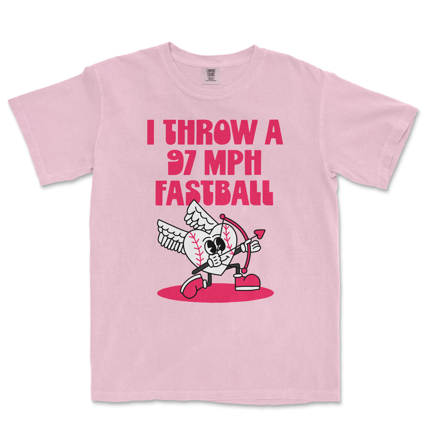 Pink Comfort Colors T-shirt with bold pink text saying "I THROW A 97 MPH FASTBALL" and a cartoon baseball character with wings, a bow and arrow.
