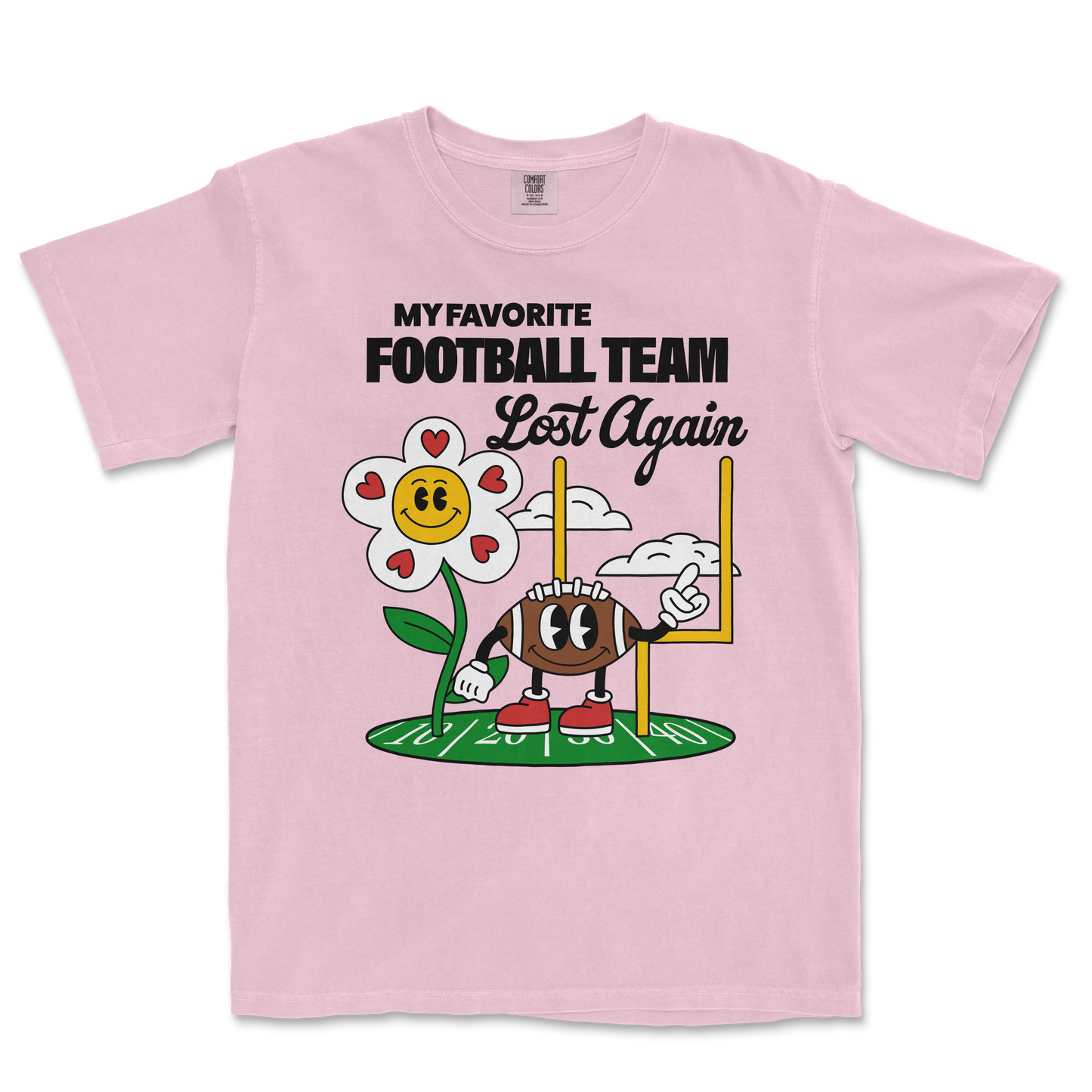 Pink Comfort Colors T-shirt with a cartoon flower and football character, featuring the text "My favorite football team lost again.