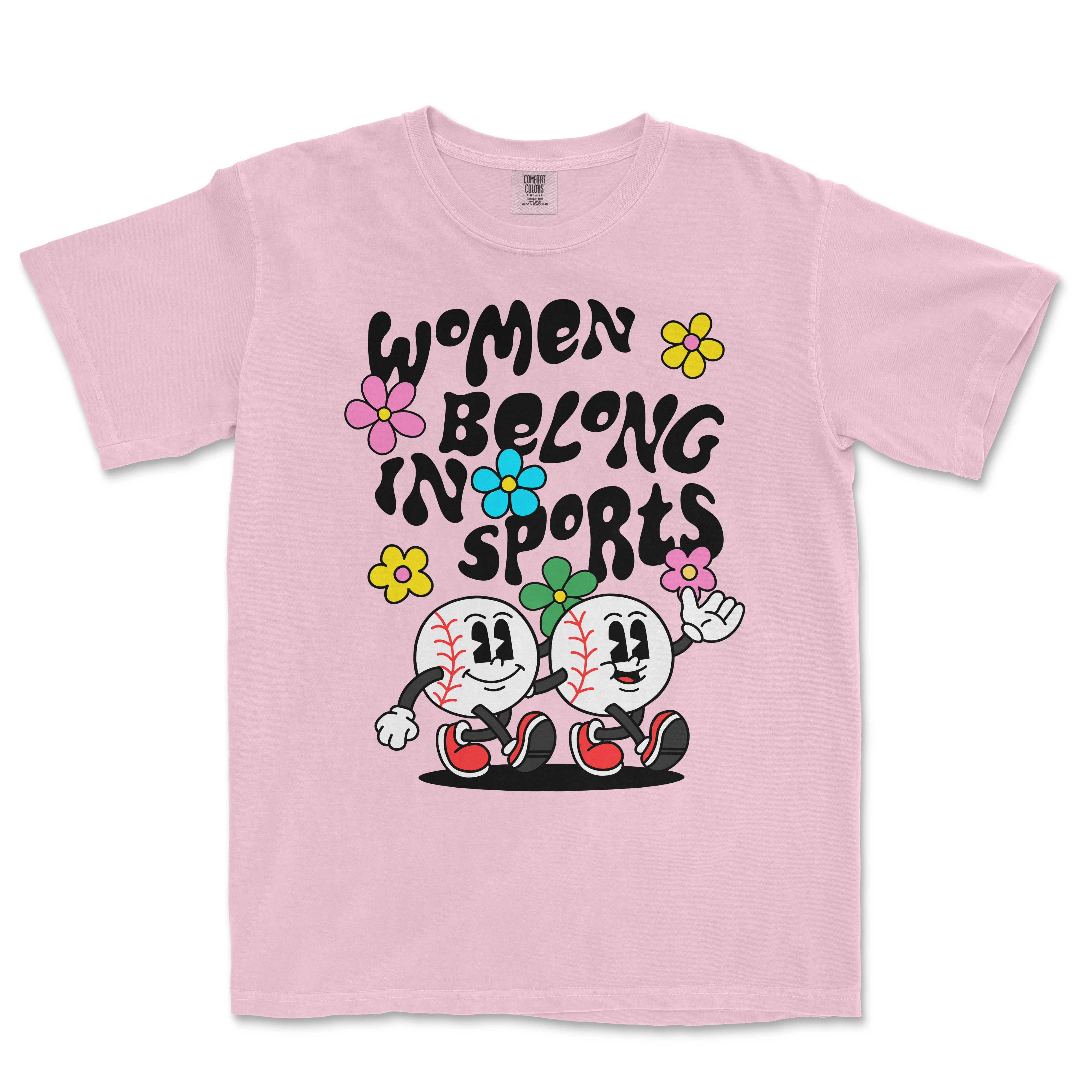 Pink T-shirt featuring cartoon baseballs with smiling faces, flowers, and the text "Women Belong in Sports" in bold black letters.