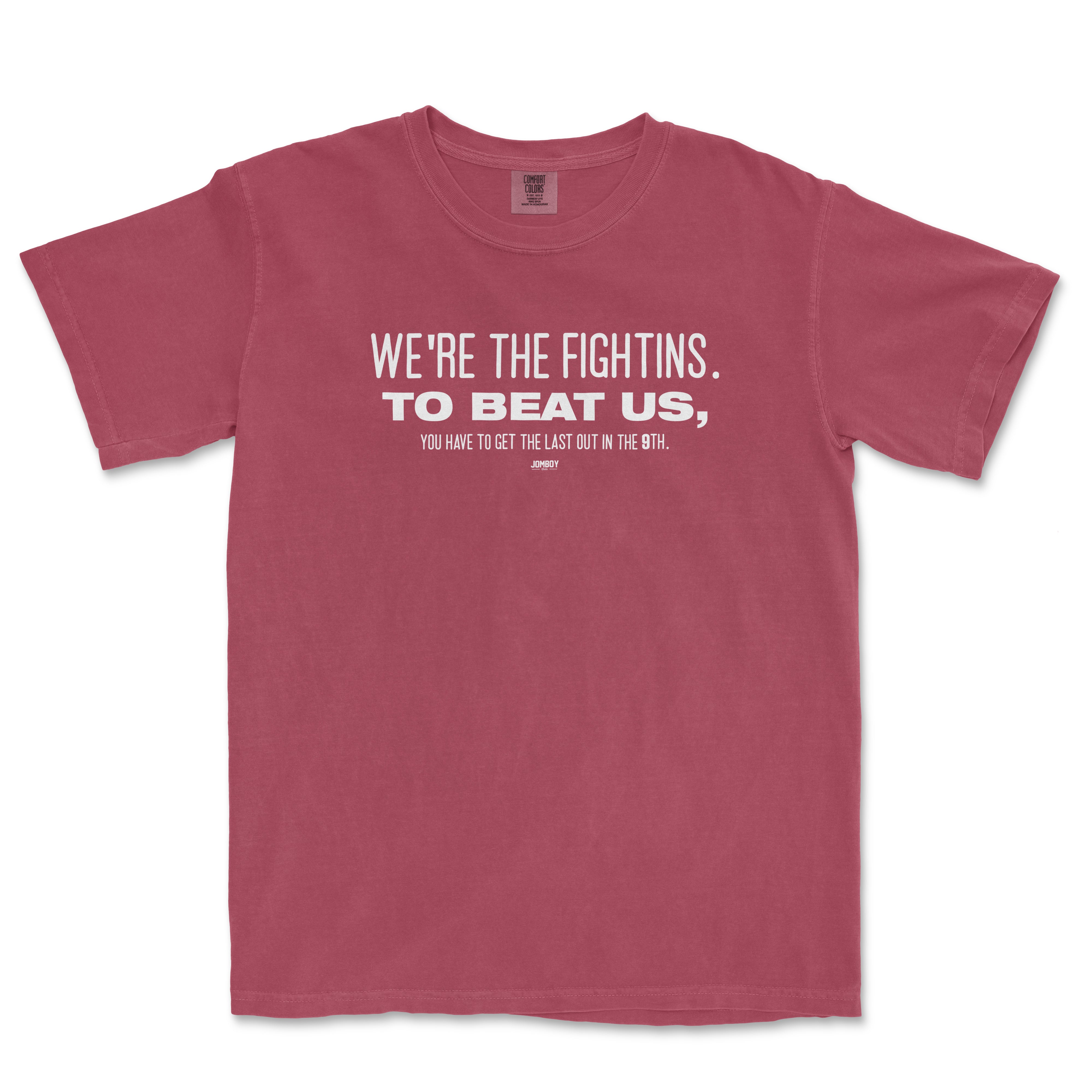 Pink T-shirt with white text reading "WE'RE THE FIGHTINS. TO BEAT US, YOU HAVE TO GET THE LAST OUT IN THE 9TH.