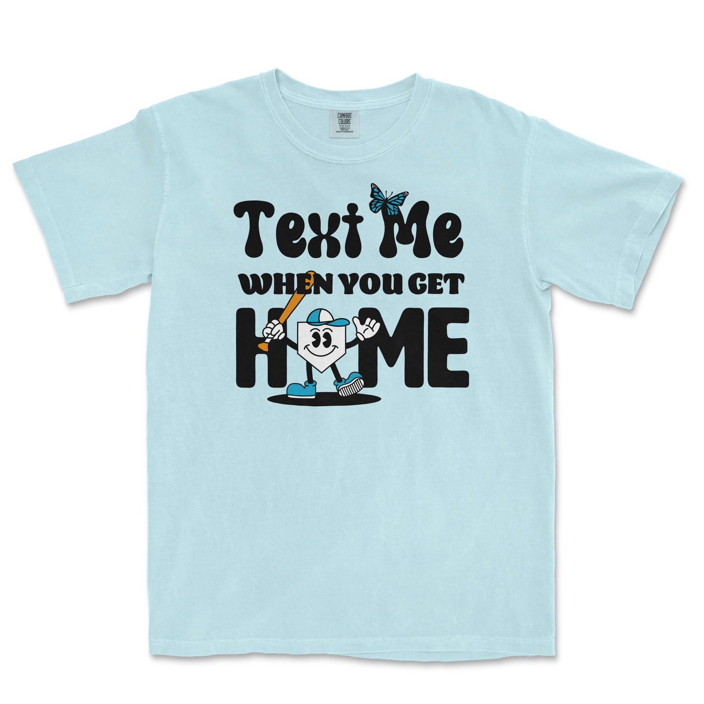 Light blue T-shirt with a cartoon character holding a bat, and text that reads "Text Me When You Get Home" in playful black font.