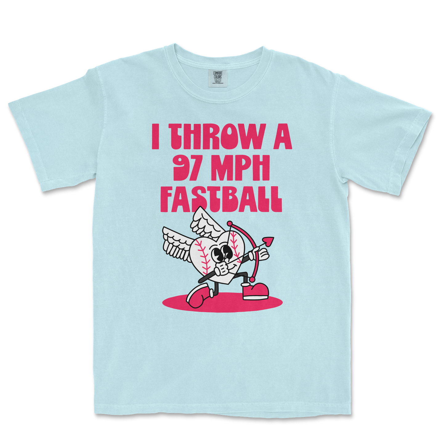 Light blue Comfort Colors T-shirt featuring a cartoon baseball with wings, holding a bow and arrow, with bold pink text: "I THROW A 97 MPH FASTBALL.