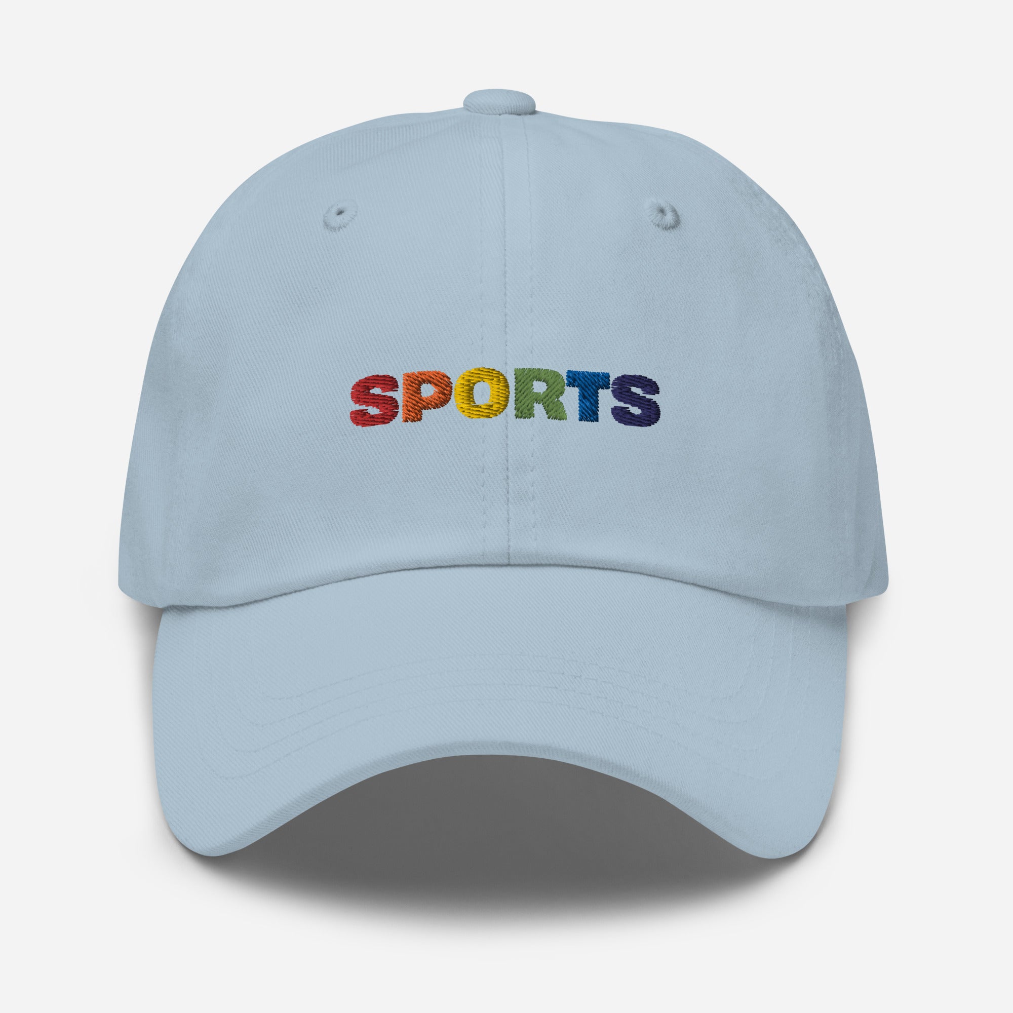 Light blue dad hat with colorful embroidered "SPORTS" text in rainbow colors, promoting inclusivity in sports.