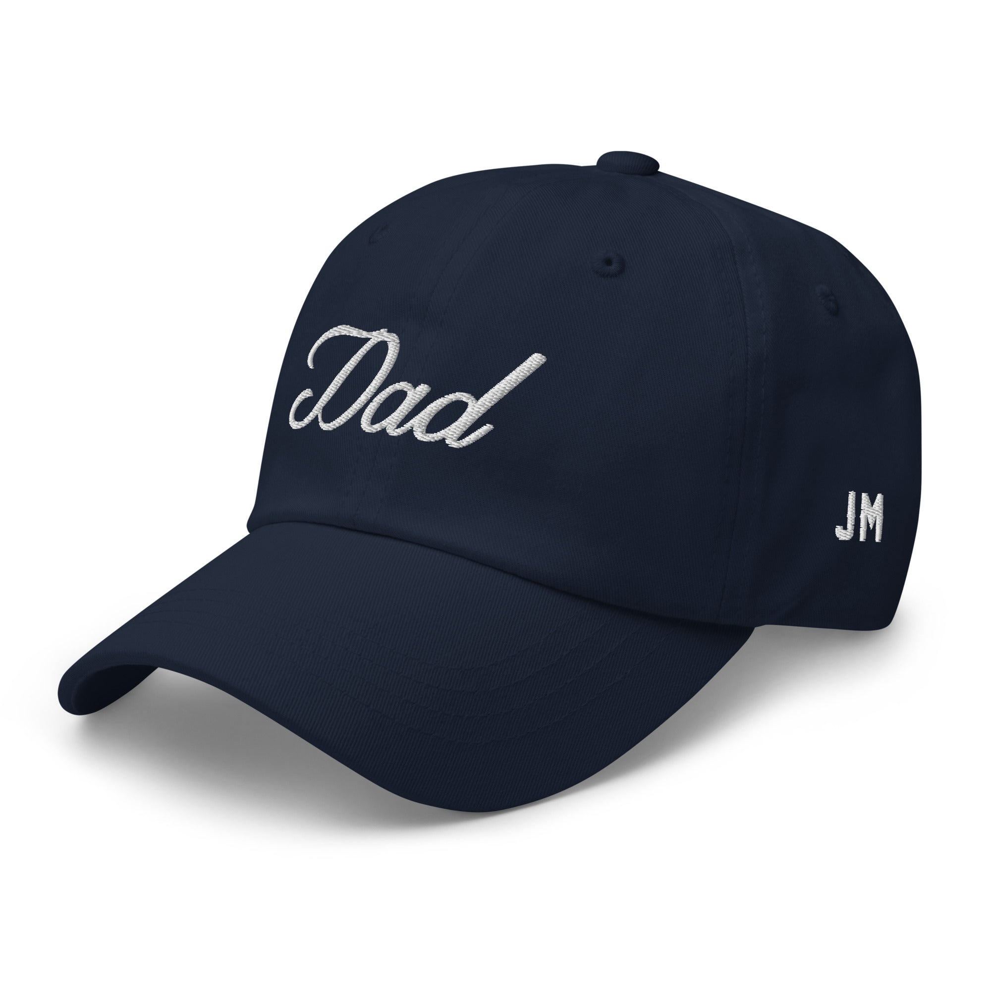 Navy dad hat with white embroidered "Dad" on front and "JM" on side, featuring a curved brim and adjustable strap.