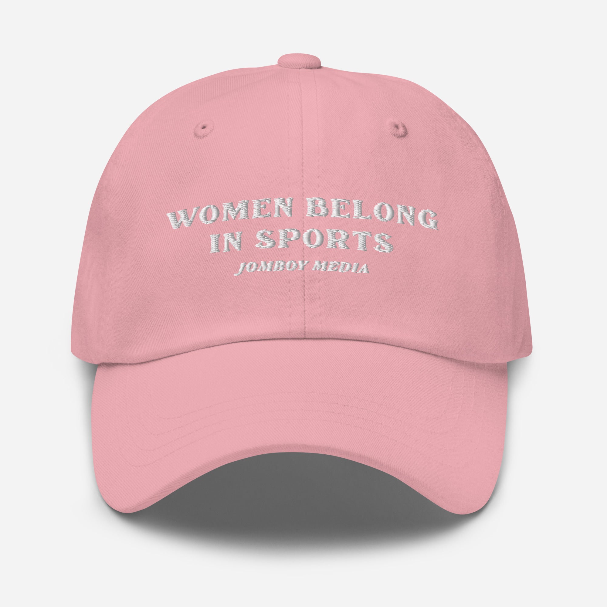 Pink dad hat with white embroidered text: "Women Belong in Sports" and "Jombo Media" underneath.