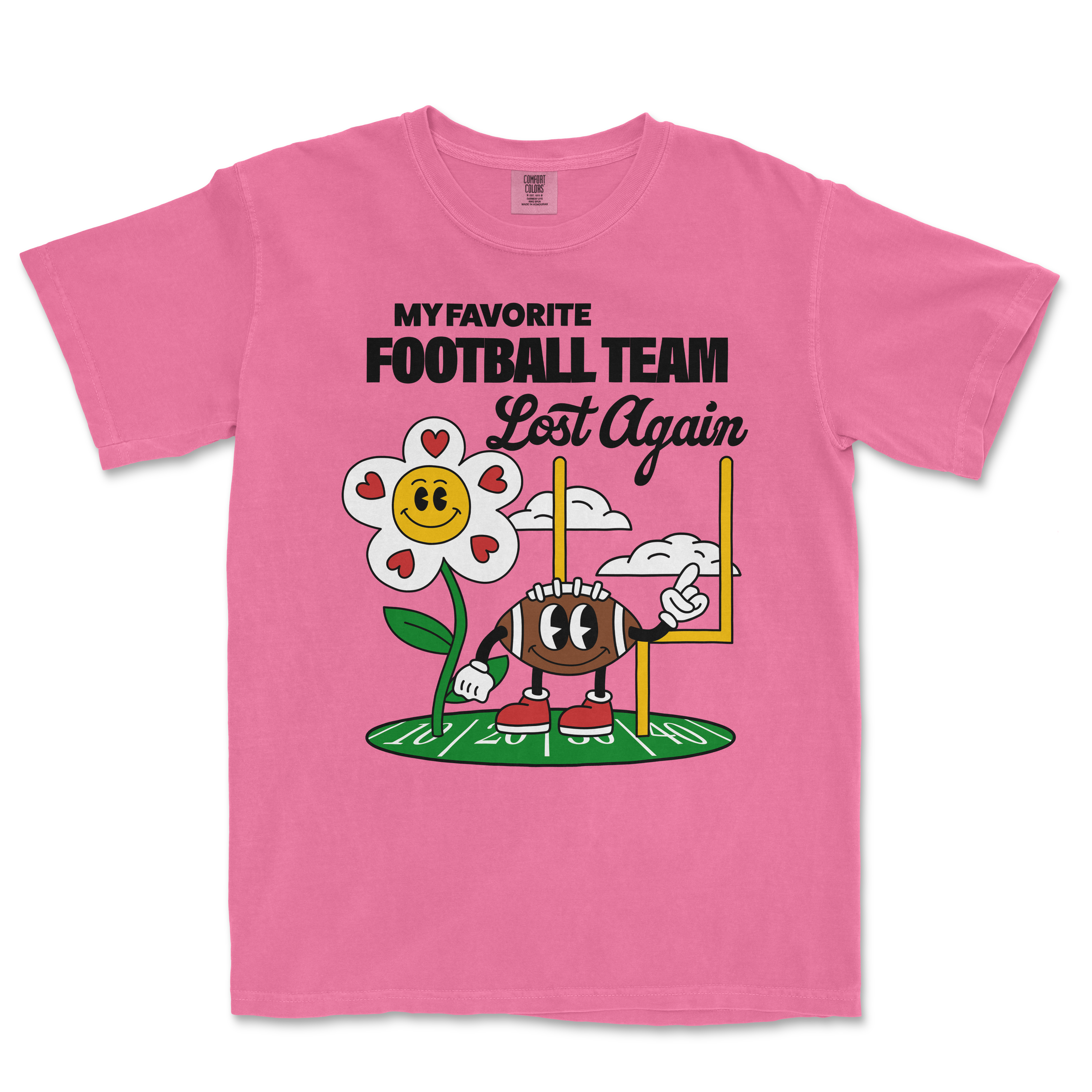 Pink Comfort Colors T-shirt featuring a cartoon football character and a smiling flower with the text "My favorite football team lost again.