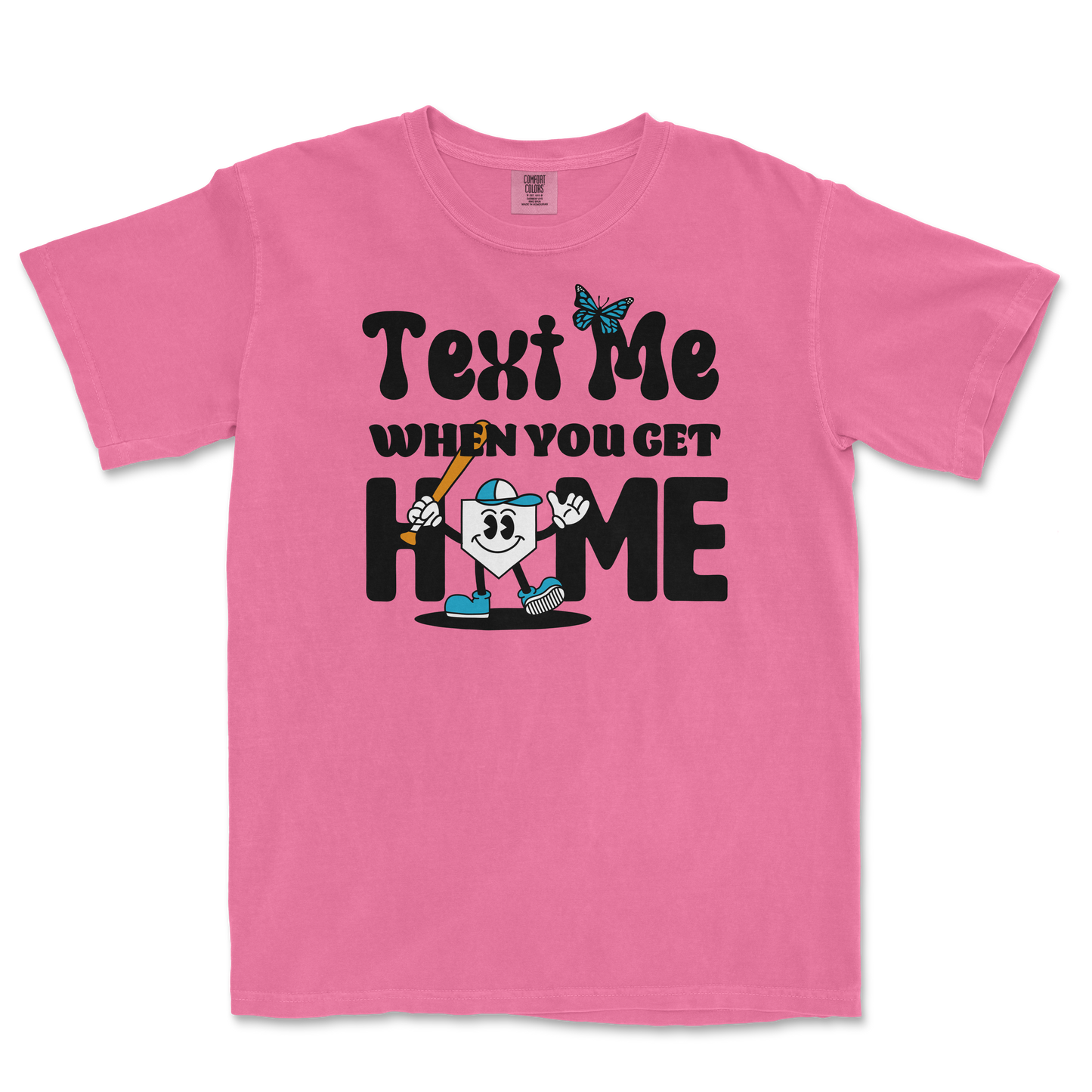 Pink T-shirt with playful black text, a cartoon character holding a baseball bat, and a butterfly graphic, with the phrase "Text me when you get home.