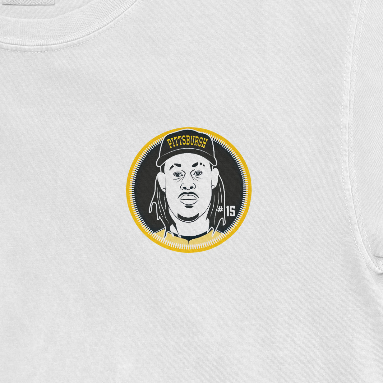 White shirsey featuring a graphic of a person with dreadlocks, wearing a cap with "PITTSBURGH" and "#15" on it.