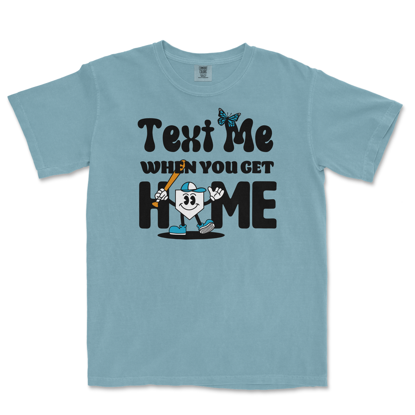 Light blue T-shirt with playful black text, a cartoon character holding a baseball bat, and a butterfly graphic.