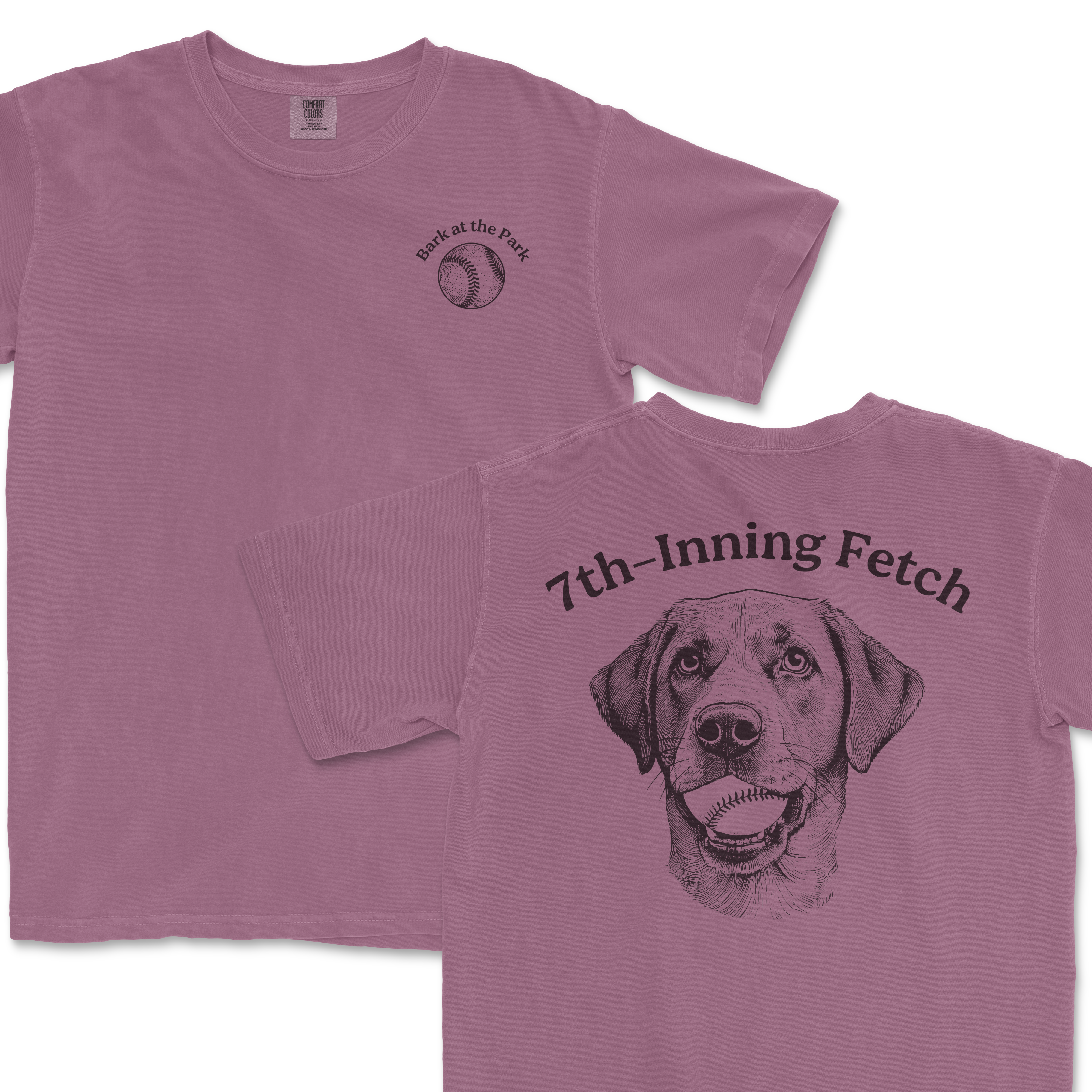 Lavender Comfort Colors T-shirt featuring a front small baseball graphic with "Bark at the Park" text and a back illustration of a dog with a baseball in its mouth, "7th-Inning Fetch" text.