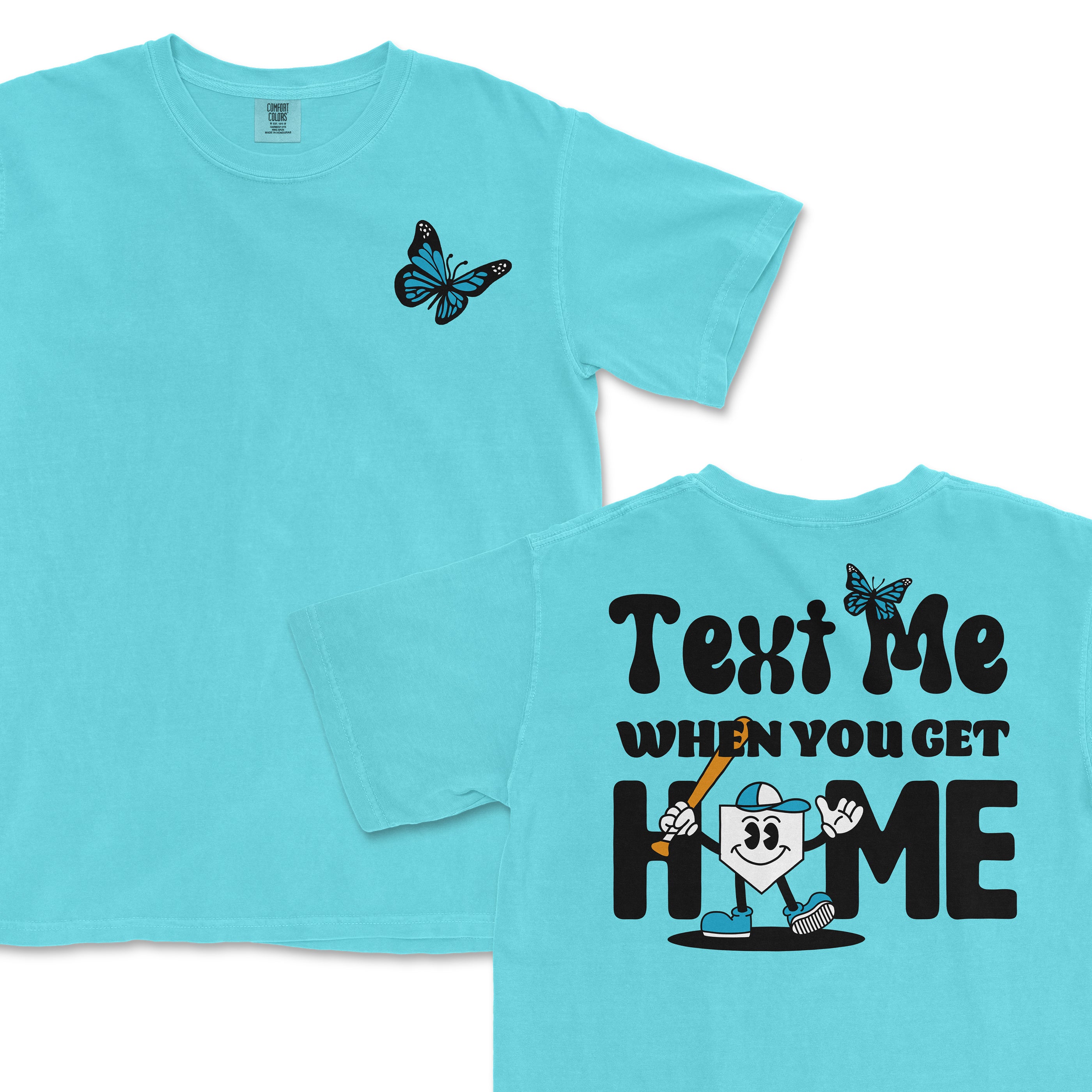 A light blue T-shirt with a butterfly graphic on the front and a playful "Text Me When You Get Home" design on the back featuring a cartoon character.