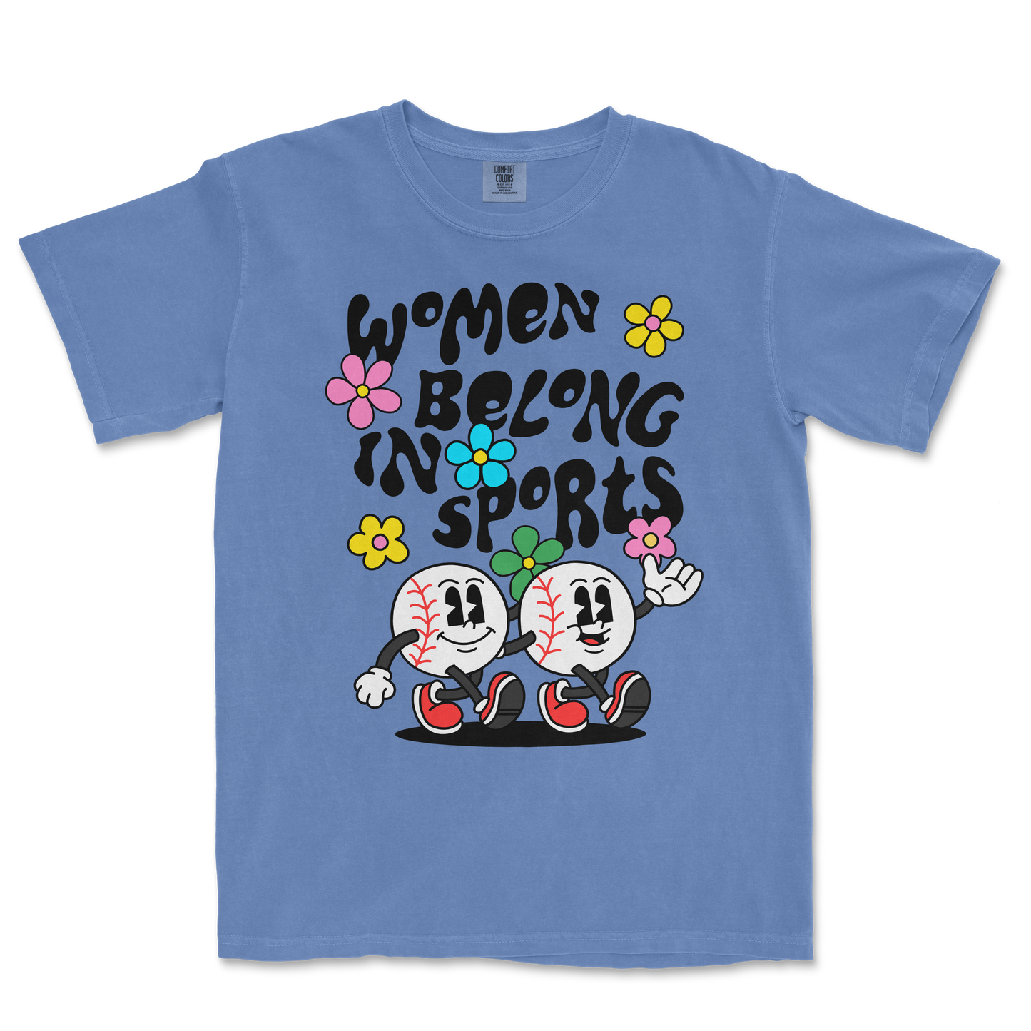 Blue T-shirt featuring cartoon baseballs with smiling faces, colorful flowers, and the text "Women Belong in Sports" in bold black letters.