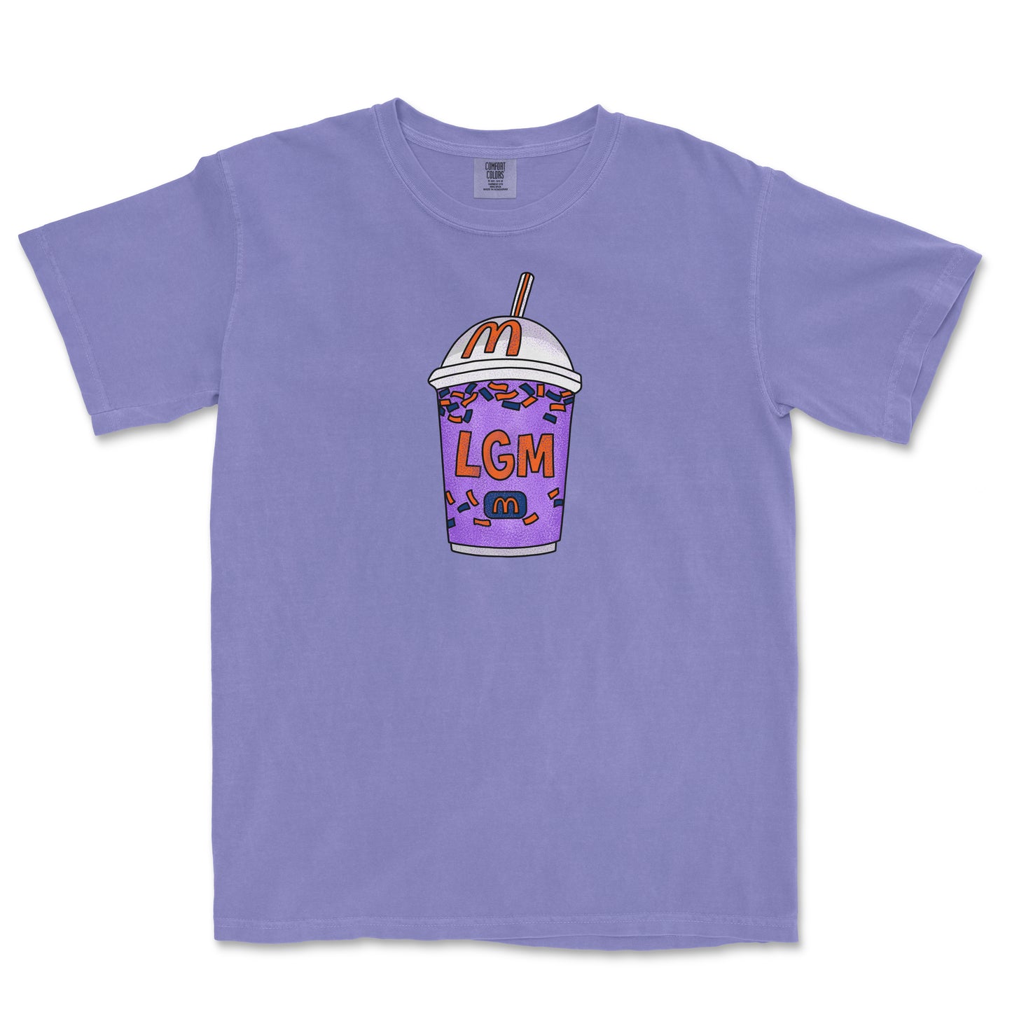Purple T-shirt featuring a colorful, cartoon-style milkshake with sprinkles, a straw, and "LGM" text on the front.