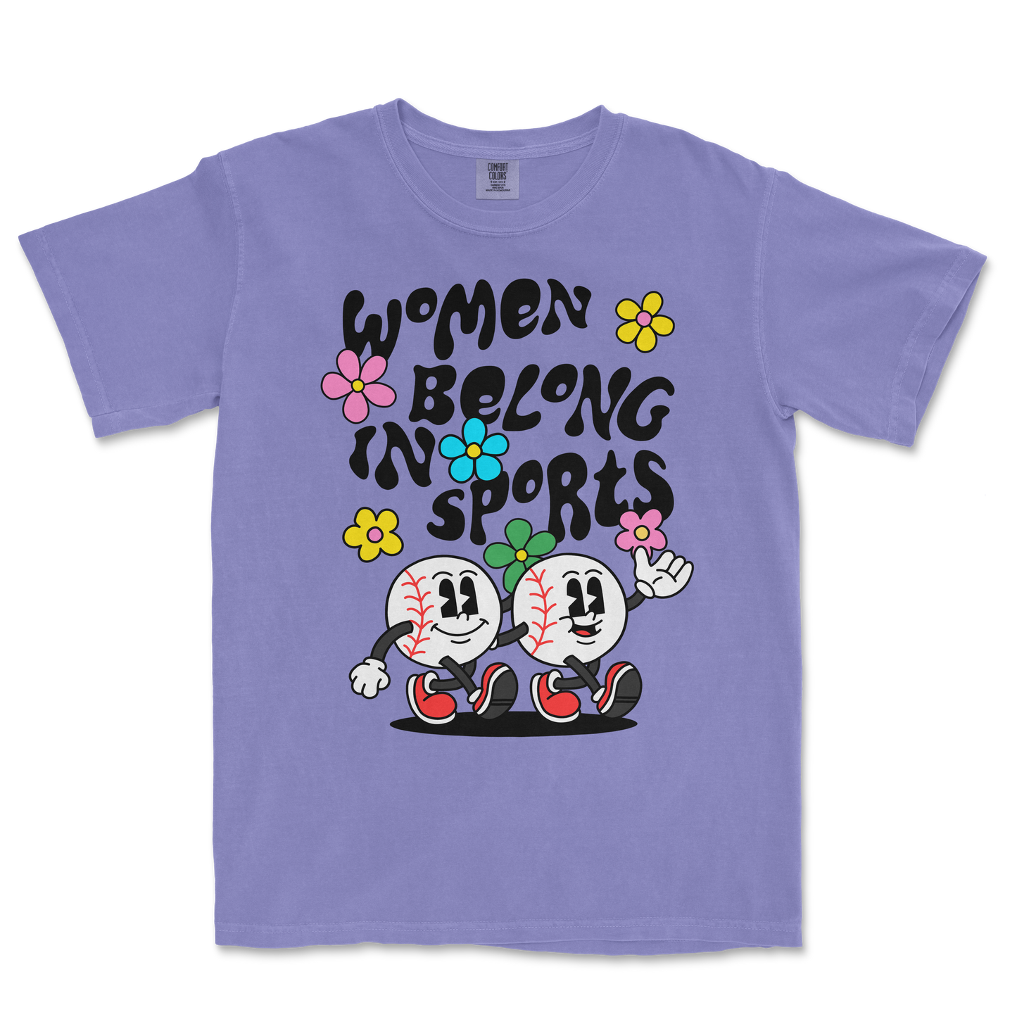 Purple T-shirt featuring cartoon baseballs with smiling faces, colorful flowers, and the text "Women Belong in Sports" in bold black letters.