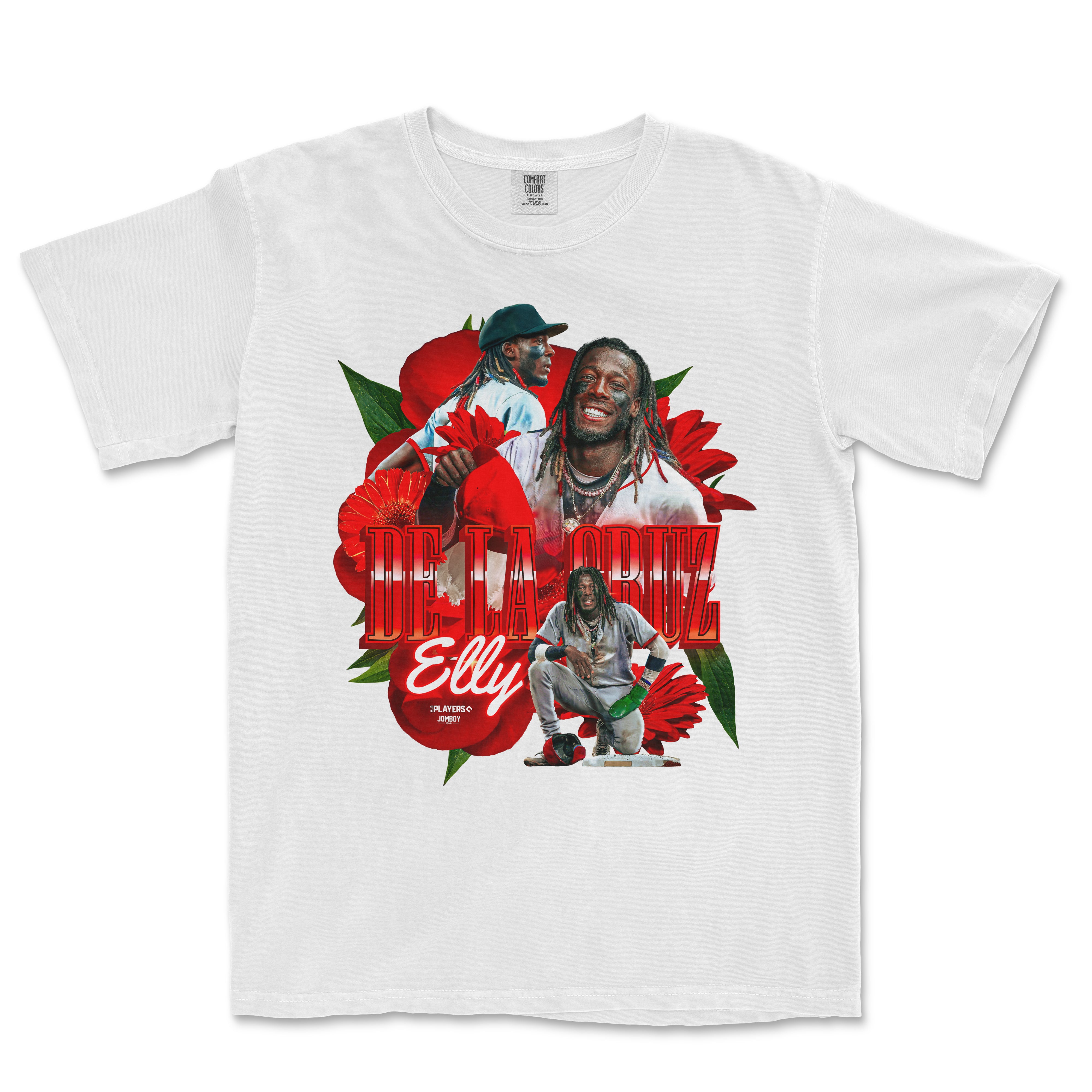 White Comfort Colors T-shirt featuring a colorful graphic of Elly De La Cruz with red flowers and bold red text.