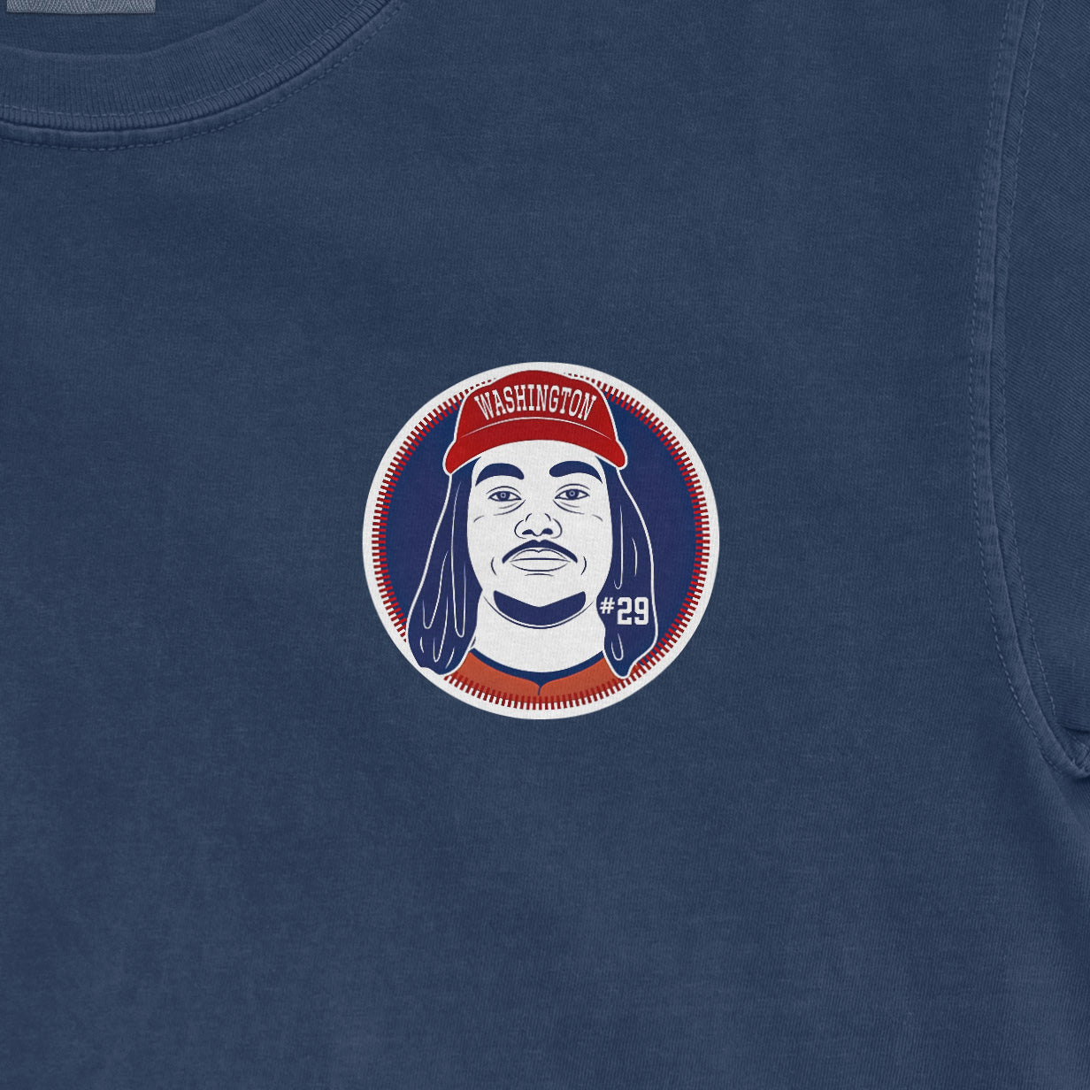 Comfort Colors tee featuring a graphic of a person with dreadlocks wearing a red Washington hat and the number 29.