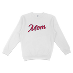 White crewneck sweatshirt with "Mom" written in large, cursive pink and navy text across the front.