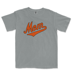 Gray Comfort Colors T-shirt with "Mom" in orange script and underline, designed for Baltimore baseball moms.