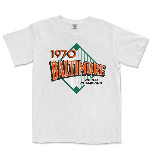White Comfort Colors T-shirt featuring a vintage Baltimore 1970 World Champions graphic with orange, green, and black text.