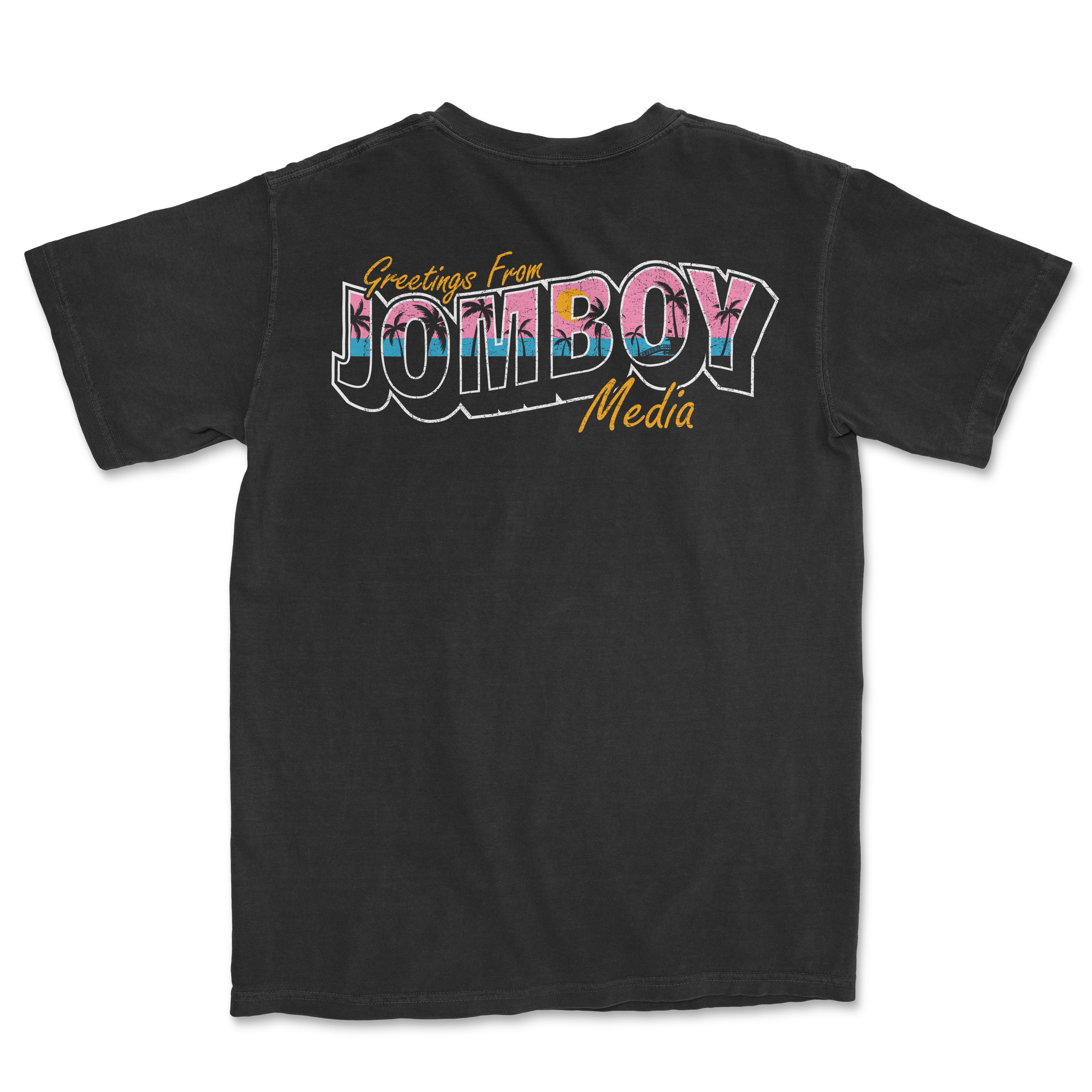 Black Comfort Colors T-shirt with colorful "Greetings from Jomboy Media" text and palm tree design on the back.