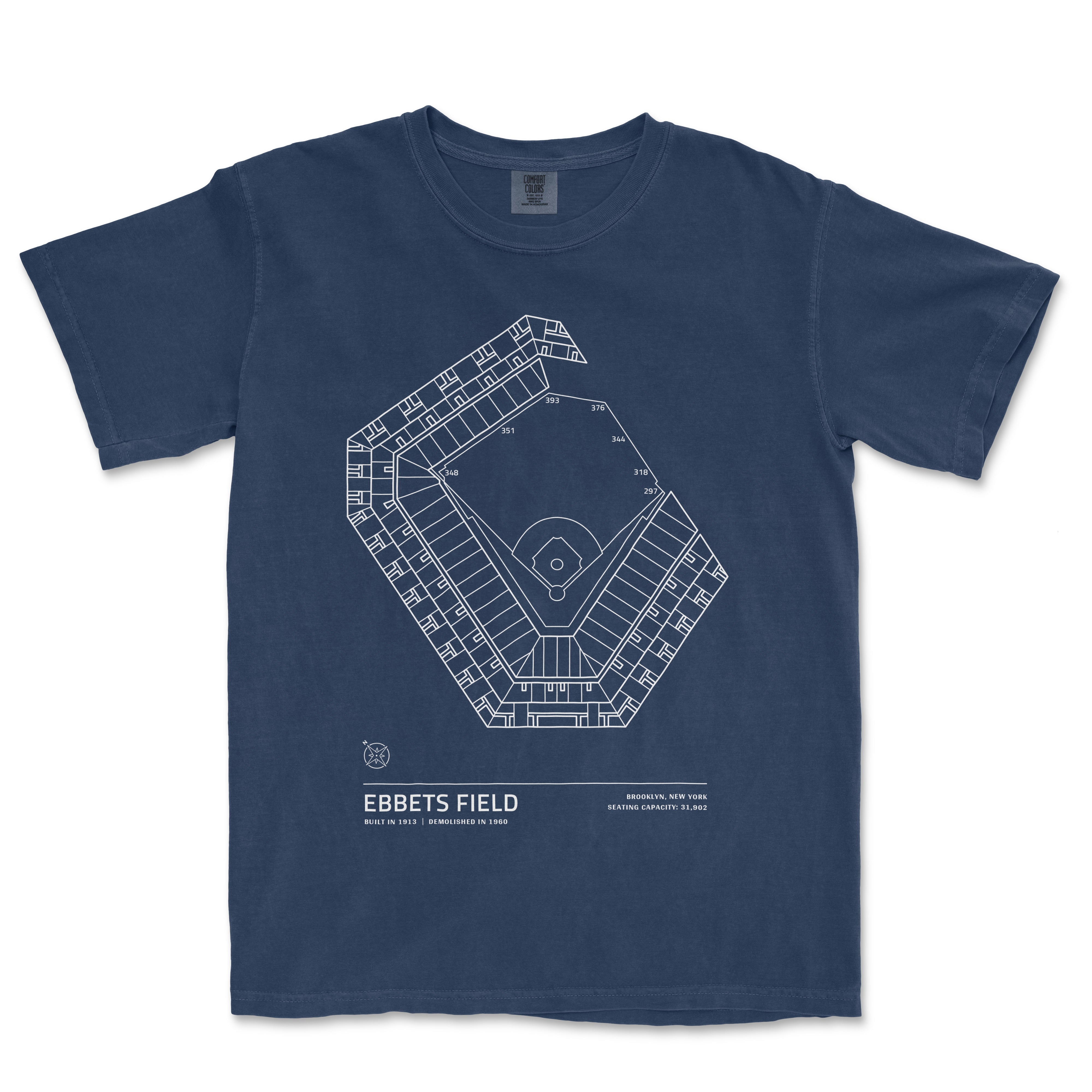 Blue Comfort Colors T-shirt featuring a white line drawing of Ebbets Field stadium layout with location details and seating capacity.