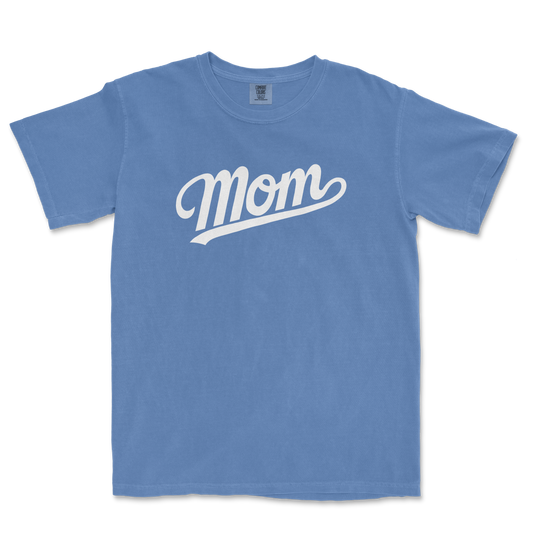 Blue Comfort Colors tee with white "Mom" text in a cursive font, perfect for a proud baseball mom.