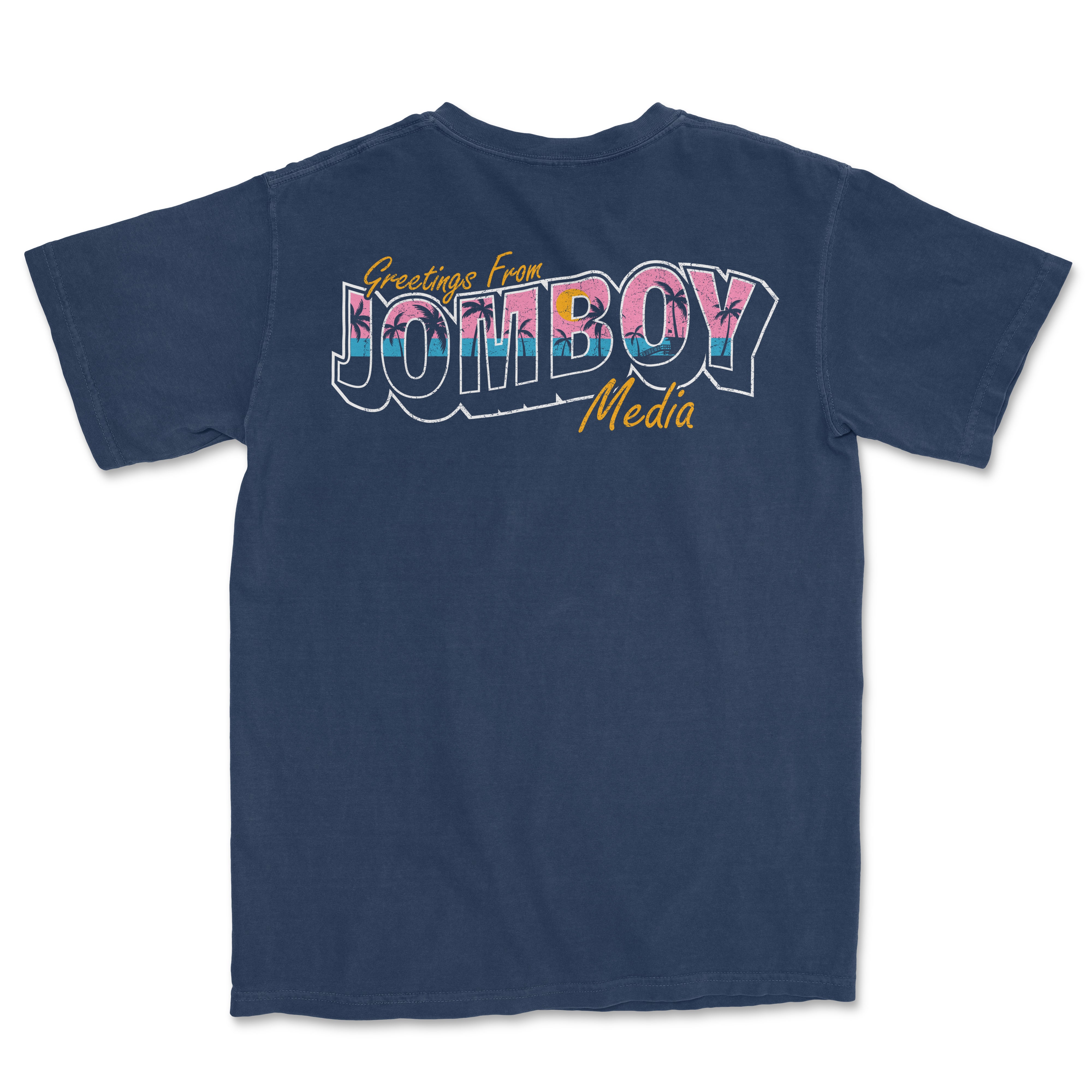 Back of navy Comfort Colors T-shirt with colorful "Greetings from Jomboy Media" graphic and yellow script text.