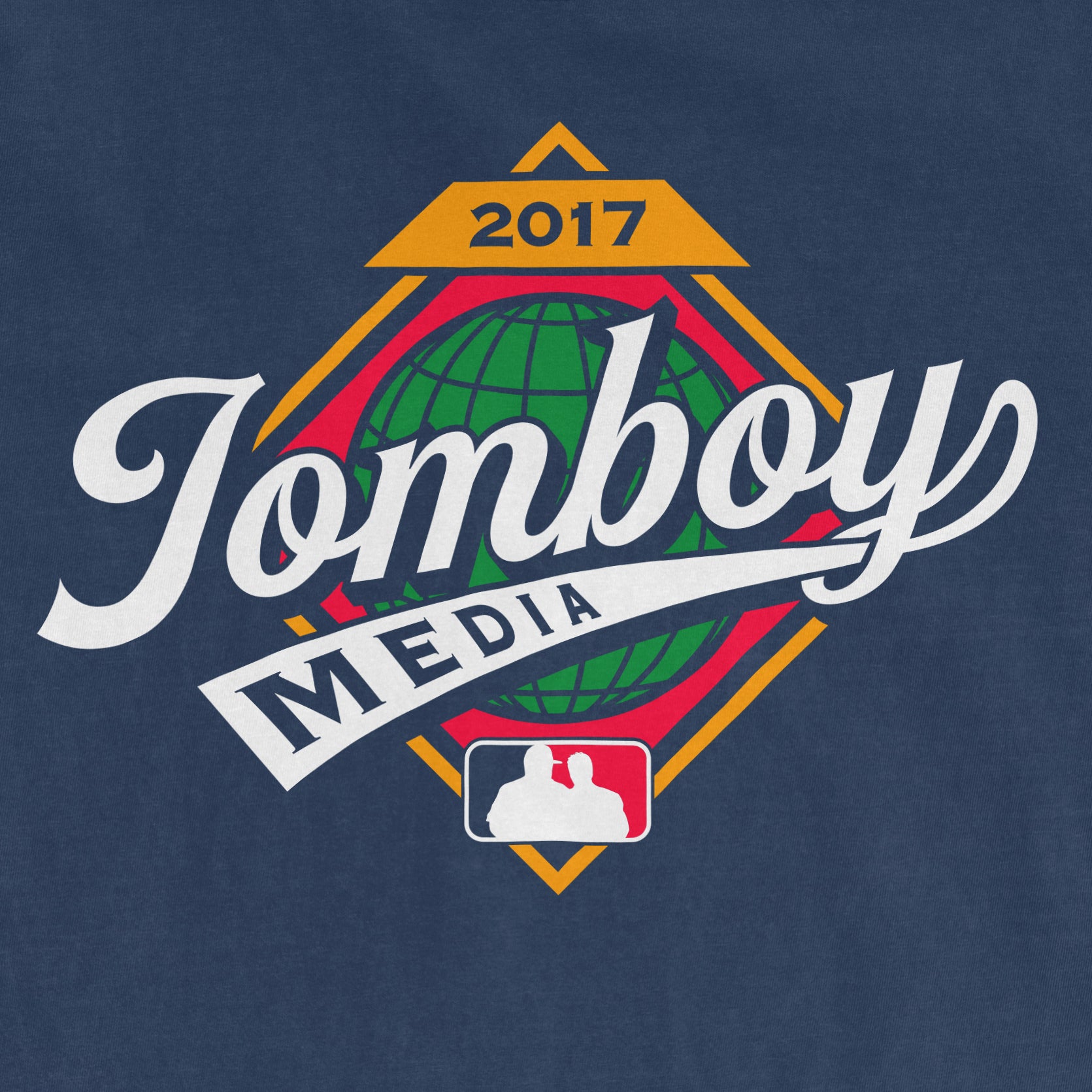 Comfort Colors T-shirt featuring the "Jomboy Media" logo with a globe, "2017" and a baseball diamond design on a navy background.