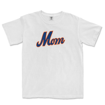 White T-shirt with "Mom" written in bold, blue and orange script across the front, celebrating Queens baseball moms.