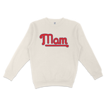 Cream-colored crewneck sweatshirt with "Mom" in bold red and blue retro-style lettering across the front.