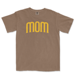Beige T-shirt with the word "mom" in large, yellow, stylized font across the front, celebrating a San Diego baseball mom.