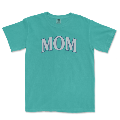 A turquoise T-shirt with the word "MOM" printed in large, stylized letters across the front.