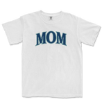 White T-shirt with "MOM" printed in bold, stylized blue letters across the chest, representing a Seattle baseball mom.