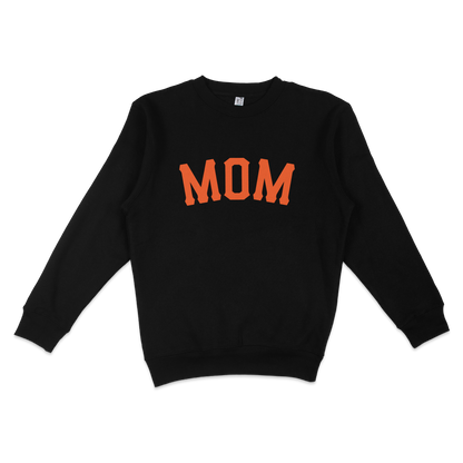 Black crewneck sweatshirt with "MOM" in bold orange letters across the front, celebrating San Francisco baseball moms.