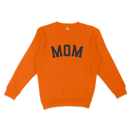 Orange crewneck sweatshirt with "MOM" in bold black letters, celebrating San Francisco baseball moms.