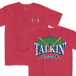 Red Comfort Colors t-shirt featuring a 'Talkin' Baseball' graphic with crossed bats and a colorful backdrop, and a small 'TXB' logo on the chest.