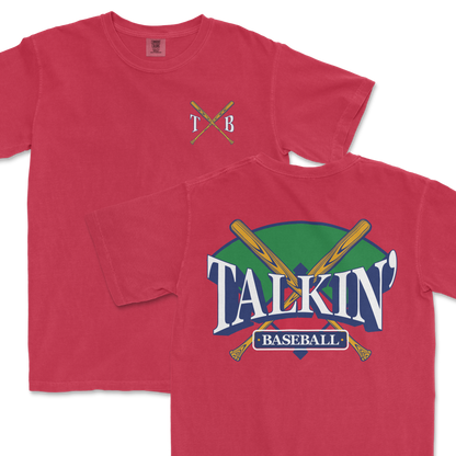 Red Comfort Colors t-shirt featuring a 'Talkin' Baseball' graphic with crossed bats and a colorful backdrop, and a small 'TXB' logo on the chest.