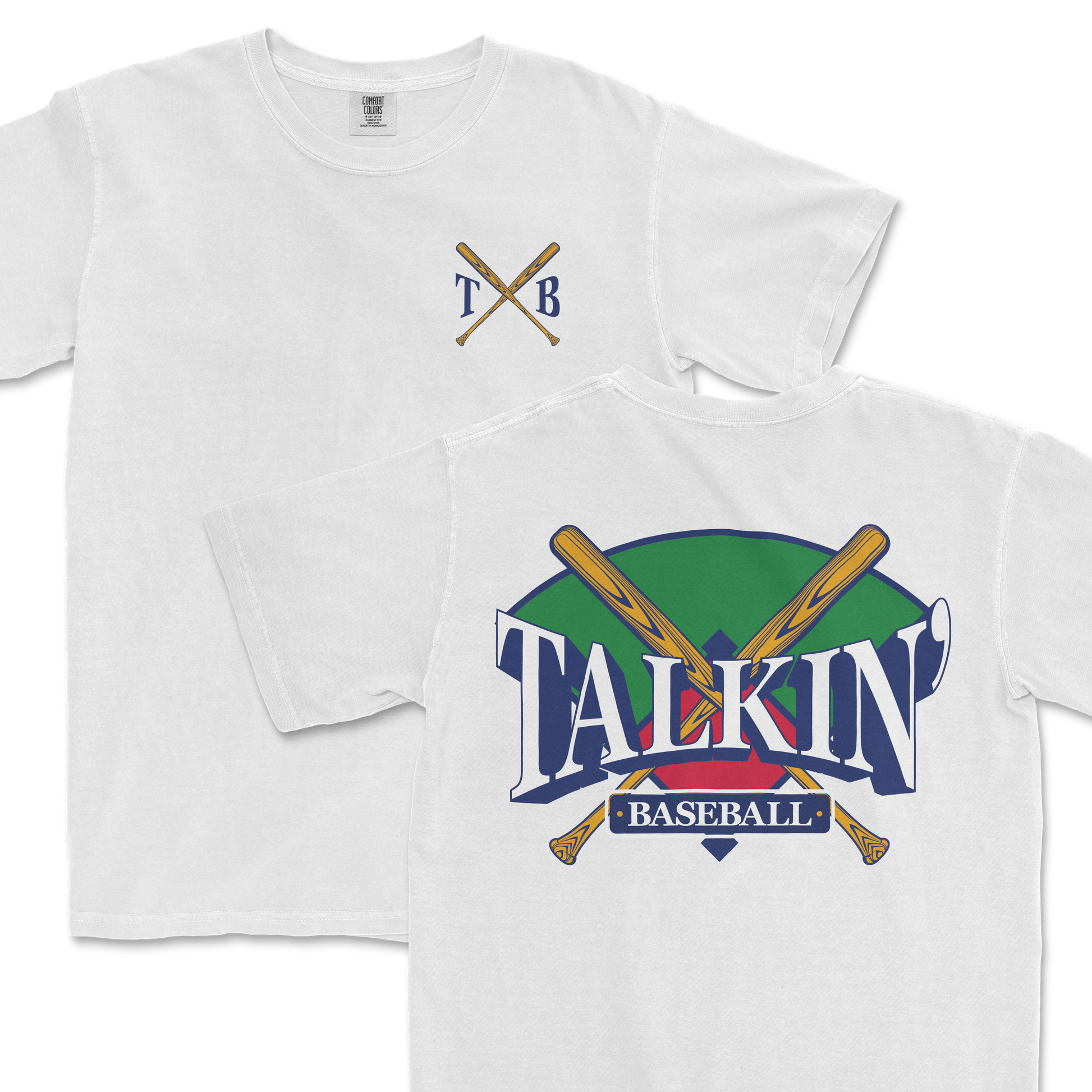 White Comfort Colors tee featuring a graphic design with crossed baseball bats and the text "Talkin' Baseball" in stylized lettering, with a green and purple background. The upper left corner includes a simple crest with the initials "TXB".