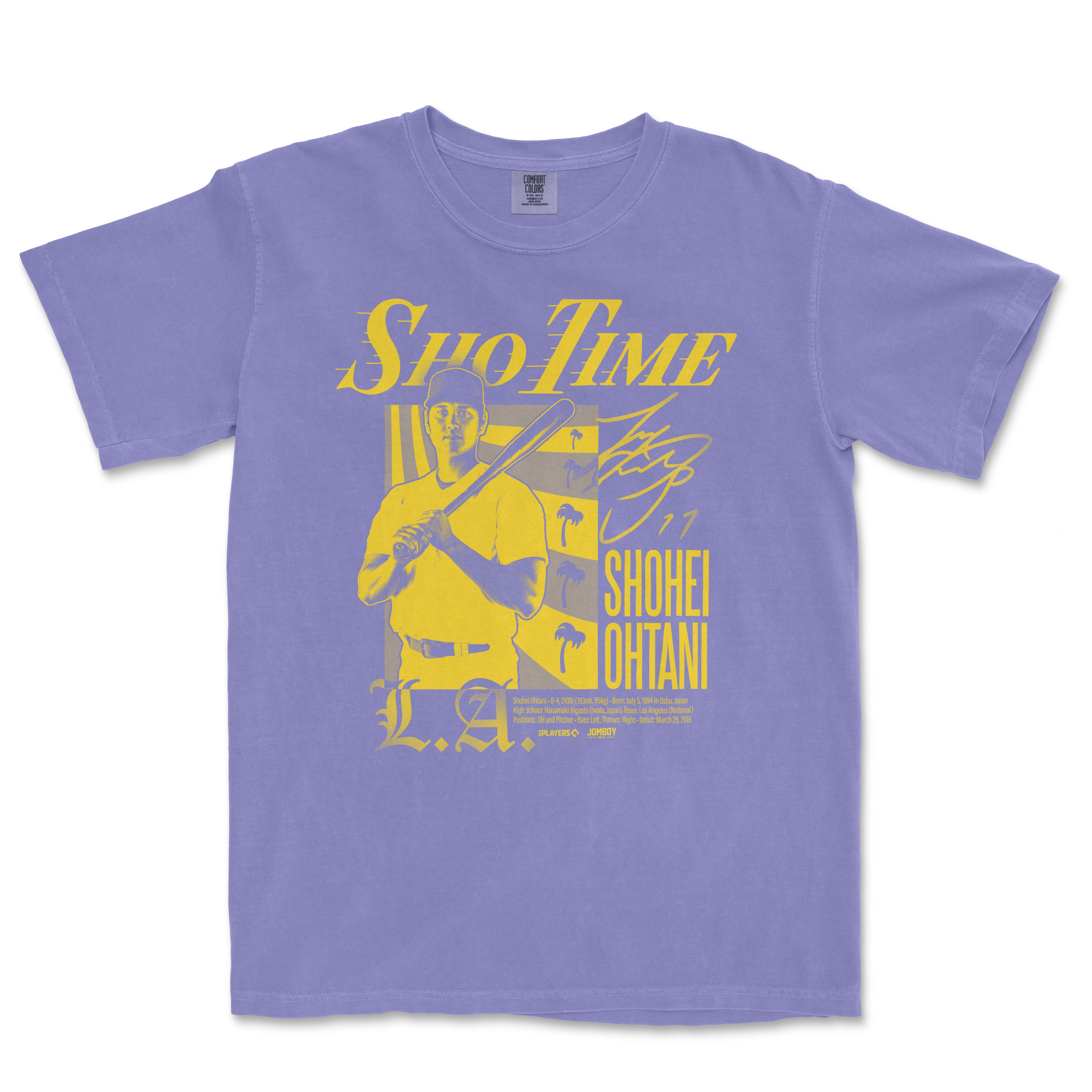 Purple T-shirt featuring a yellow graphic of a baseball player holding a bat, with "Sho-Time" text and signature, inspired by Shohei Ohtani.