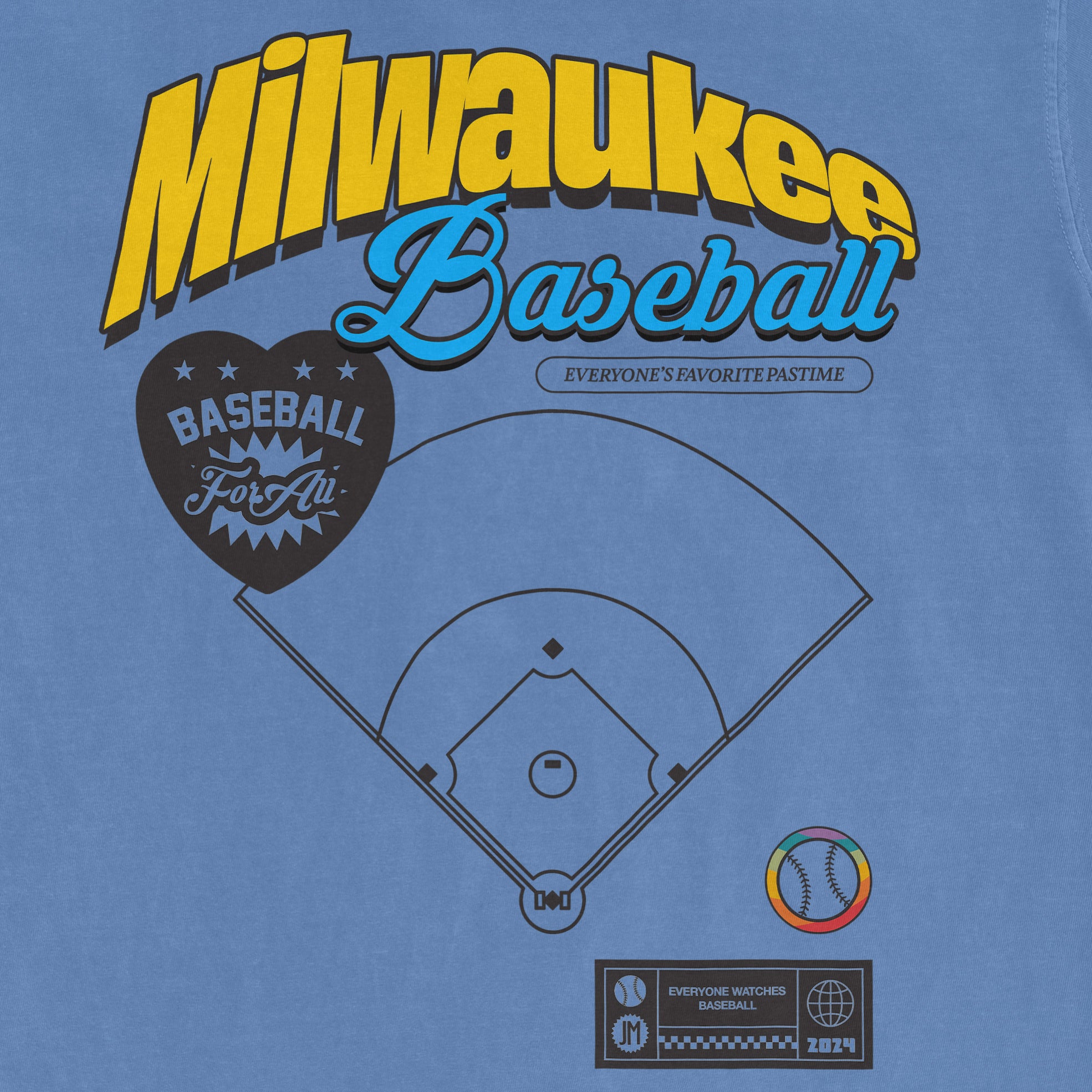 Blue Comfort Colors vintage tee featuring a Milwaukee Baseball design with a baseball diamond, colorful ball graphic, and text celebrating baseball.