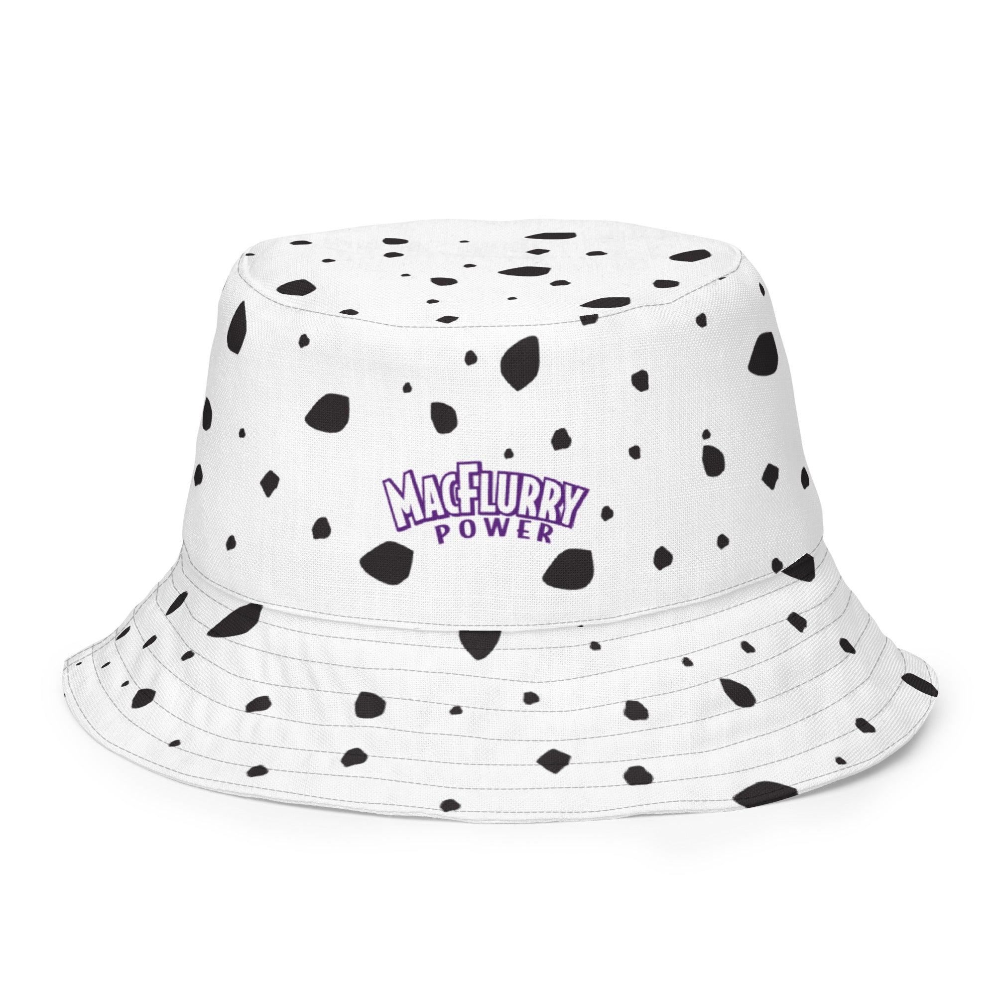 Reversible white bucket hat with black Dalmatian spots and "MacFlurry Power" logo in purple on the front.