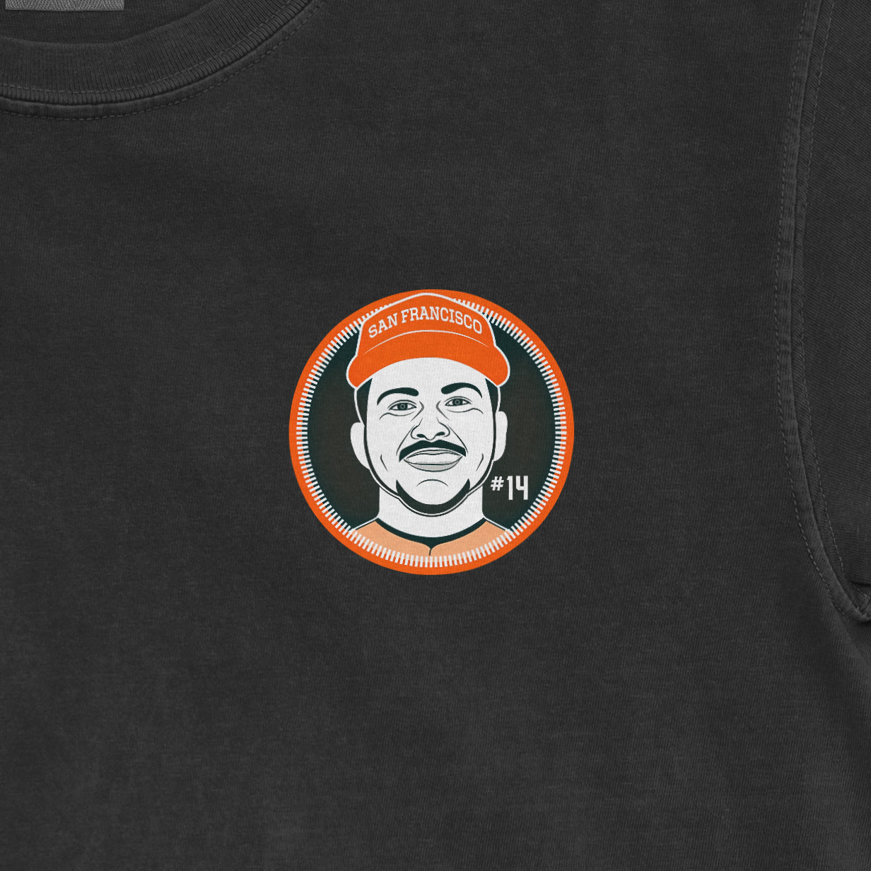 Close-up of a black Patrick Bailey shirsey featuring a circular graphic of a man wearing an orange cap with "San Francisco" text, and "#14".