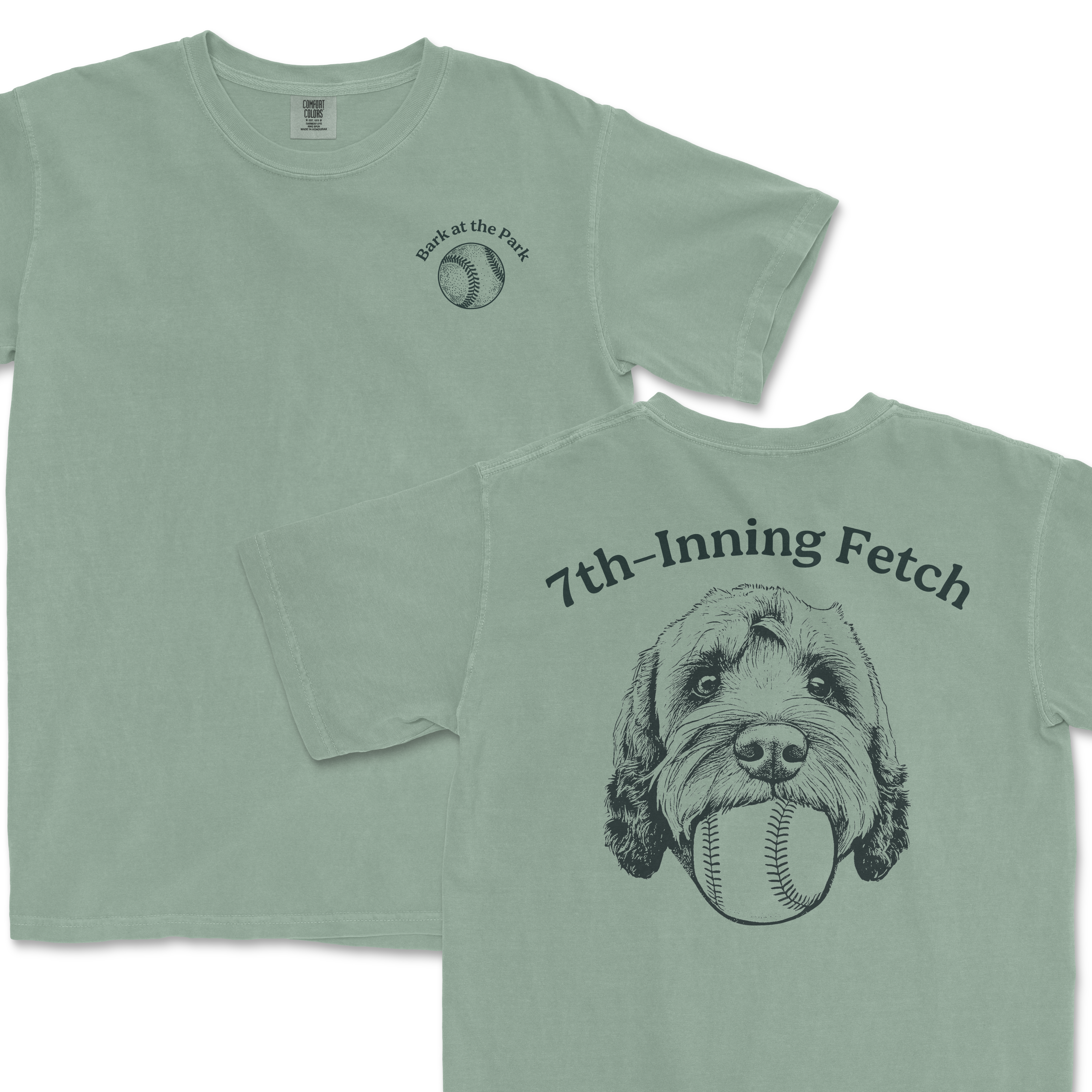 Light green Comfort Colors T-shirt with "7th-Inning Fetch" text, a Goldendoodle illustration holding a baseball, and "Bark at the Park" text.