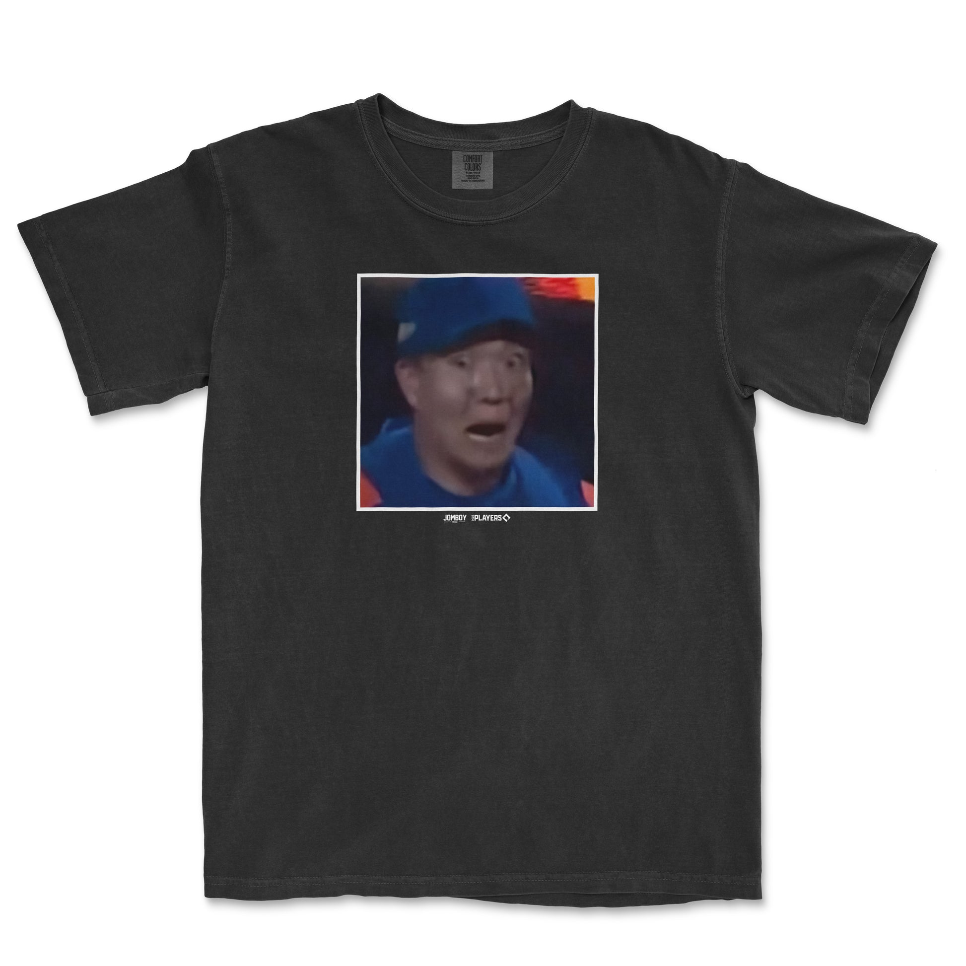 Black Comfort Colors T-shirt featuring a surprised expression of Kodai Senga, with a pixelated photo and small text below.