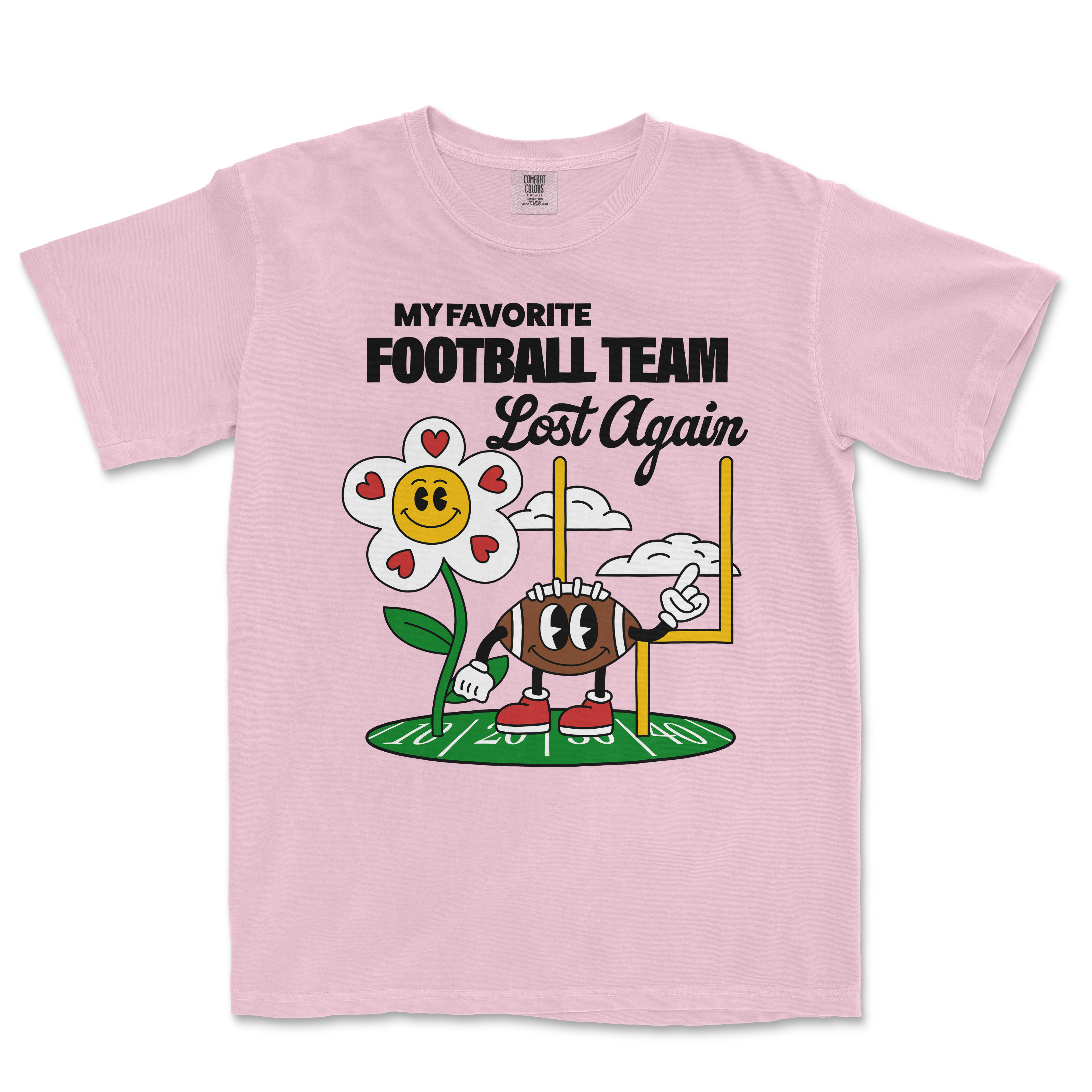 Pink Comfort Colors T-shirt with a cartoon flower and football character, featuring the text "My favorite football team lost again.