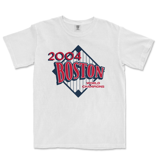 White Comfort Colors T-shirt featuring a 2004 Boston World Champions graphic with a baseball diamond design and bold red and navy text.